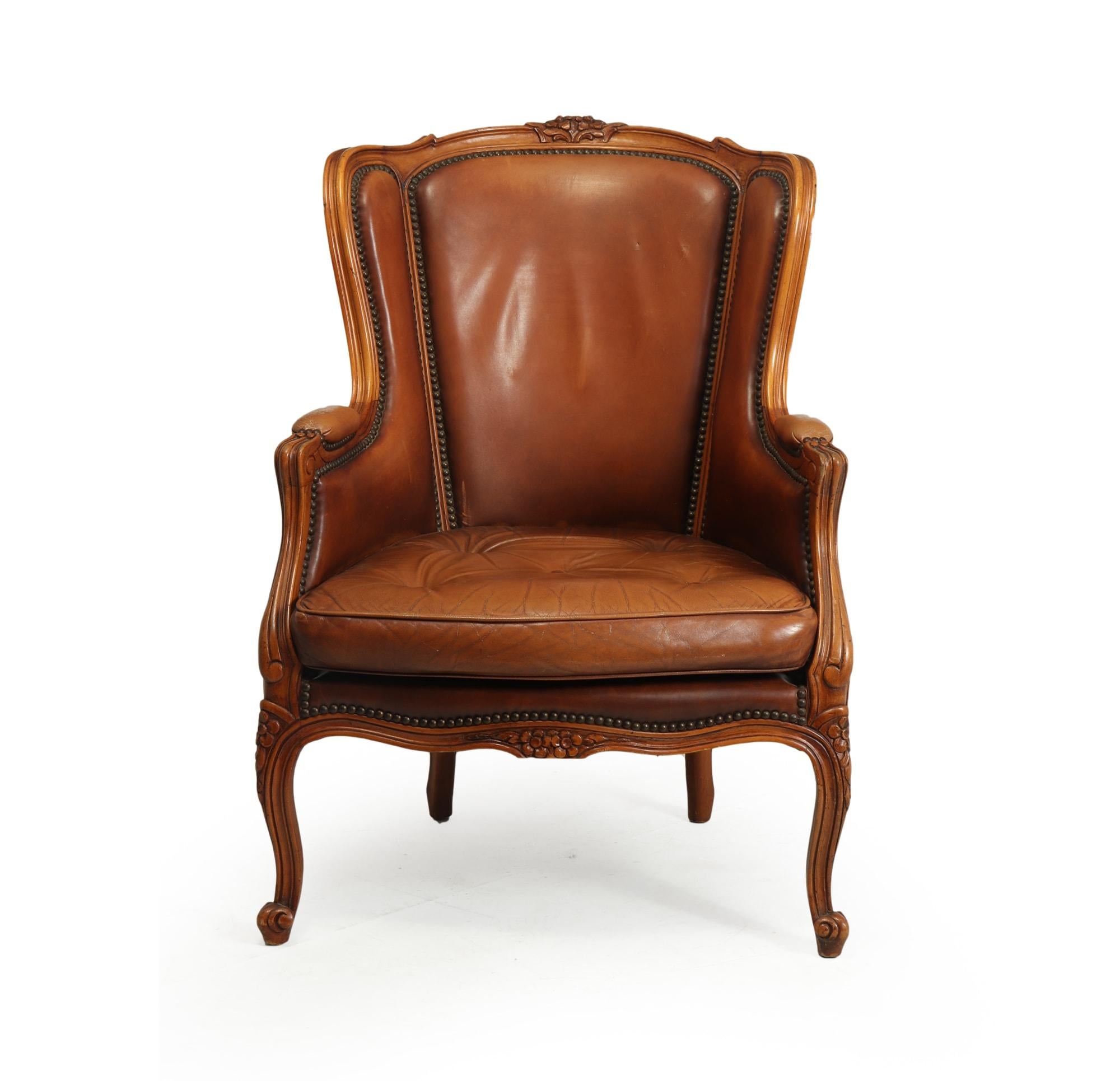 Produced in France in the mid 20th century, with leather buttoned seating area and back, to the outside is bergere caining, the caining is all in perfect condition age related wear to leather and frame, overall in very good original