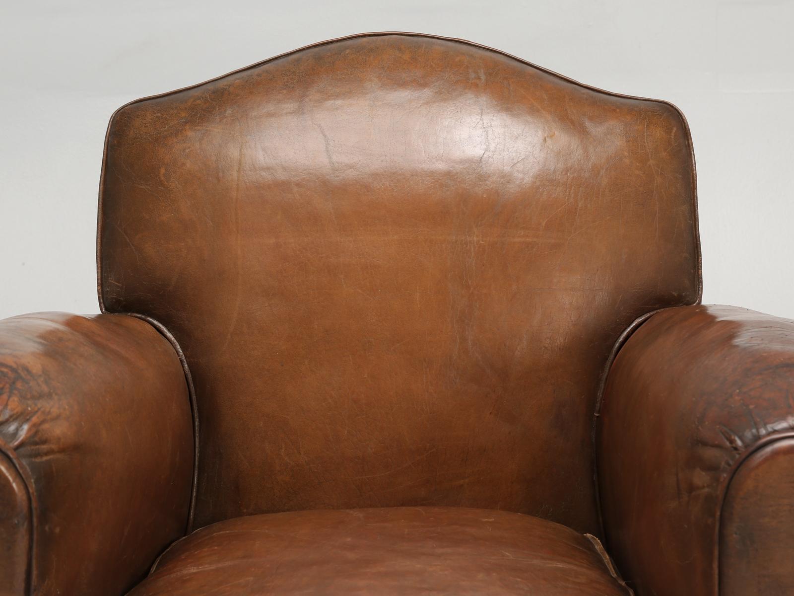 French Art Deco leather club chair that was restored by our own, old plank upholstery department. Our upholsters, carefully open each and every club chair, that enters their workshop and begin the laborious and conscientious process, of determining,