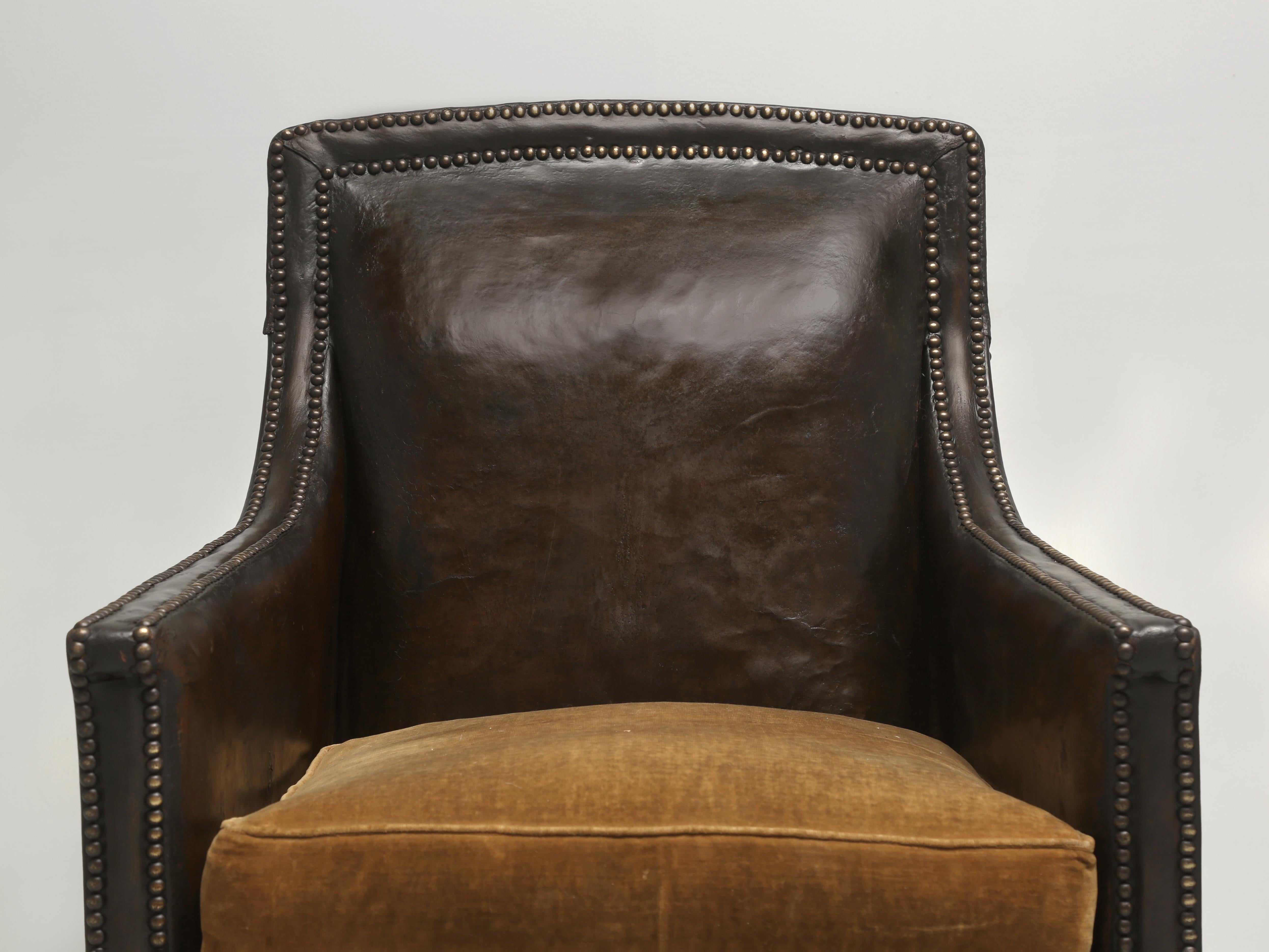 French Leather Club Chairs and like most of the very early French Club Chairs the original seat cushions were made with down filled Velvet and not leather. Our 