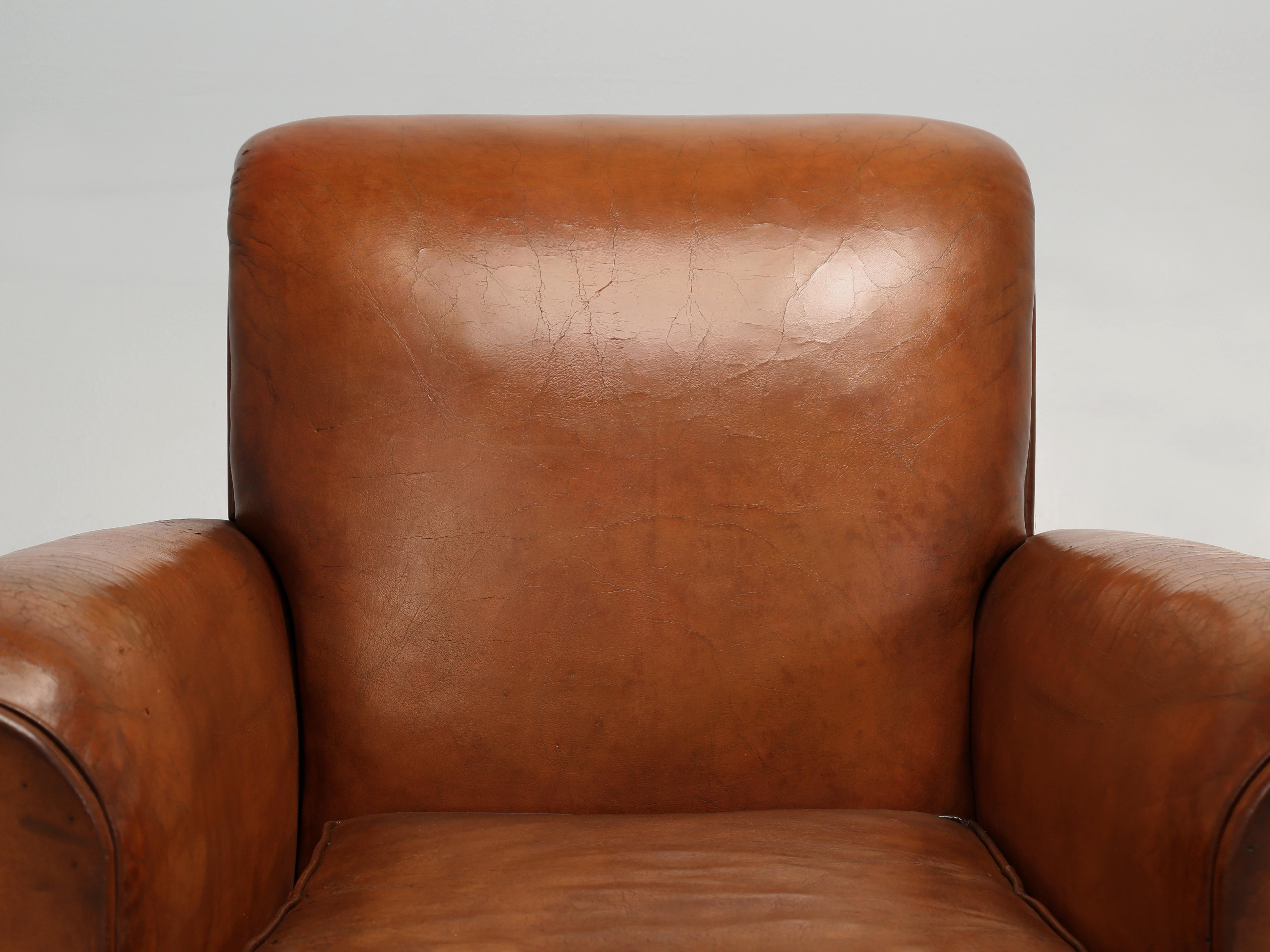 French Leather Club Chairs from the Art Deco Period. We purchased this matching pair of French Club Chairs outside of Toulouse, France and immediately upon their arrival, placed the Club Chairs into our Old Plank Upholstery Department for