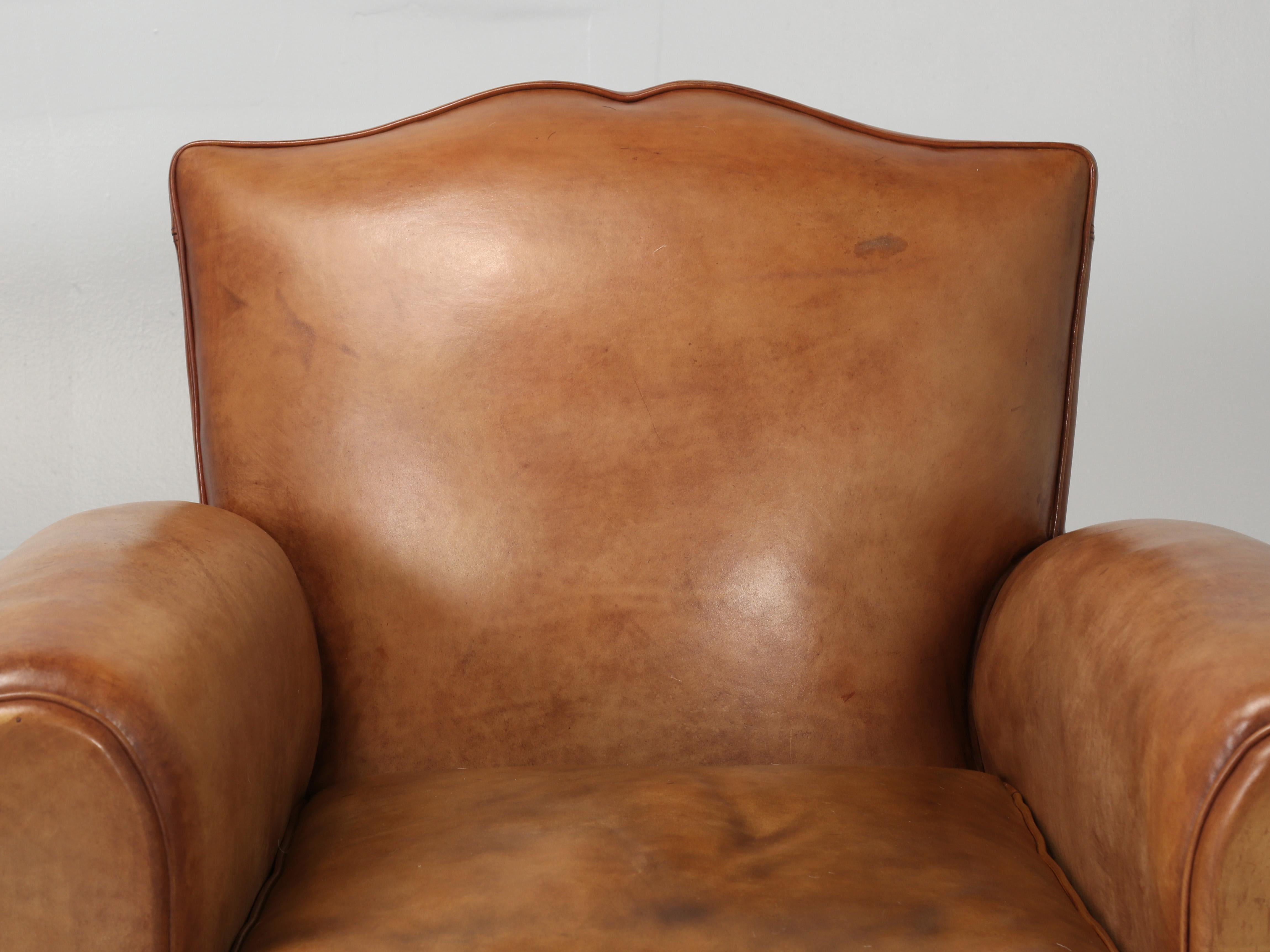 Rarely, do we ever find a set of (4) matching original French leather club chairs. Our inhouse old plank upholstery department has painstakingly completely disassembled and rebuilt to better than new standards. During the restoration of the French