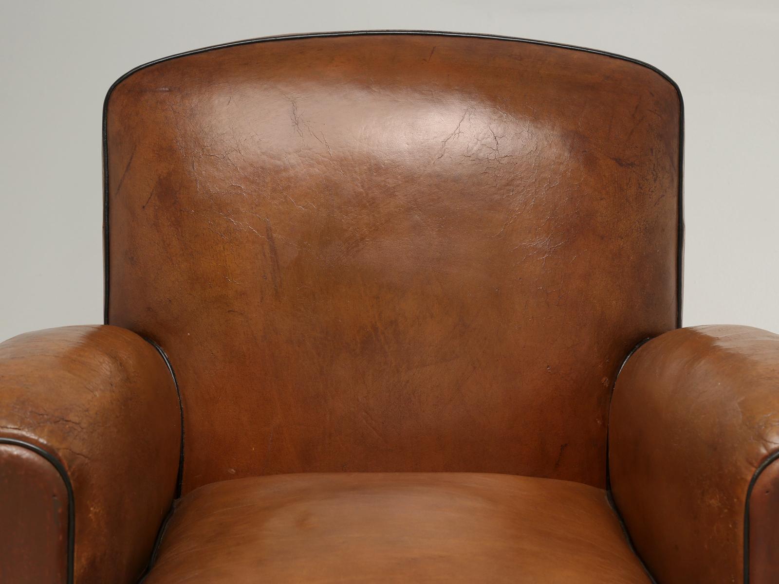 Another pair of French leather club chairs which have just emerged from our inhouse old plank upholstery department. In order to properly conserve or restore one-single club chair, you are looking at roughly 52-man hours of labor. Old Plank has made