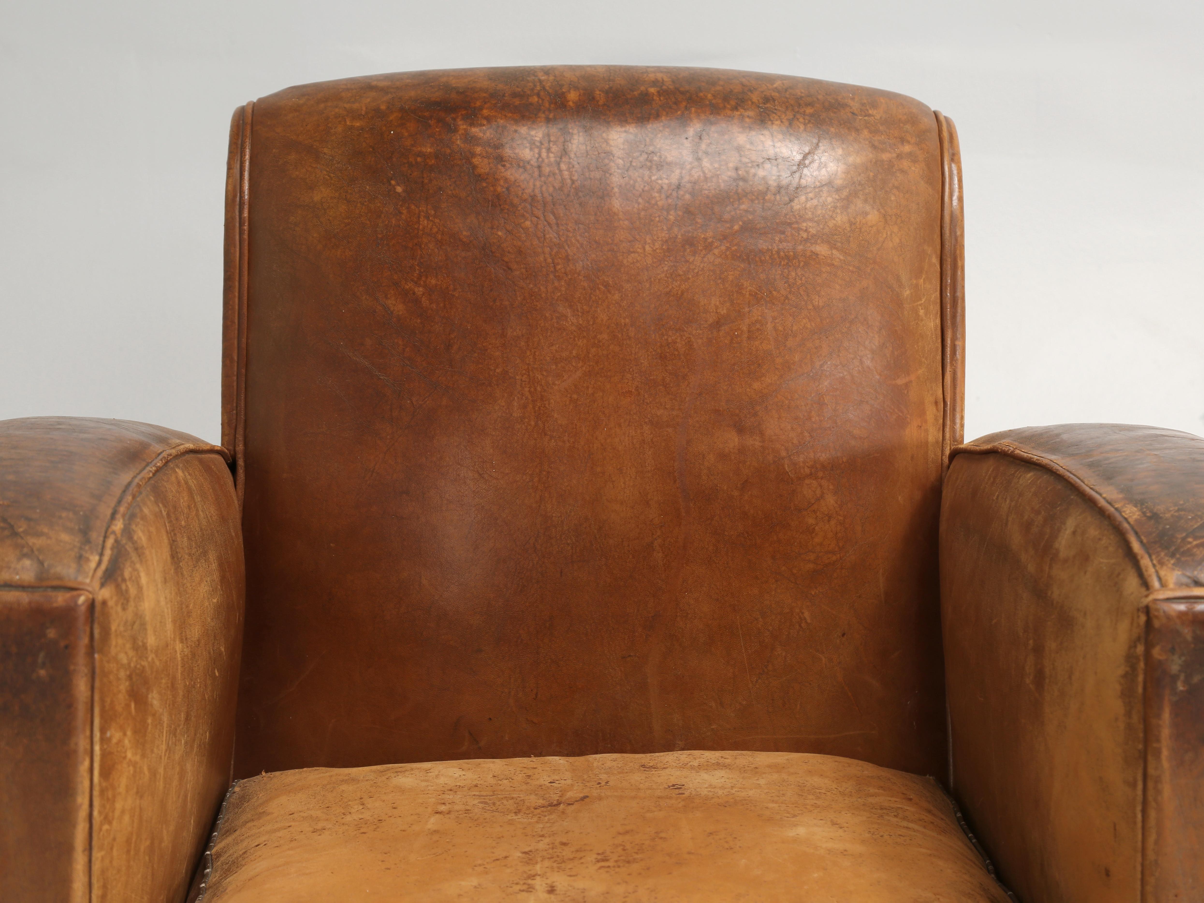 French leather club chairs that are Unrestored Cosmetically, but Completely Restored on the Inside. Extremely Rare Set of (4) Matching All Original French Art Deco Leather Club Chairs, that are still in the Old French Leather. Each of the French