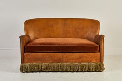 French Leather Settee with fringed Tassels