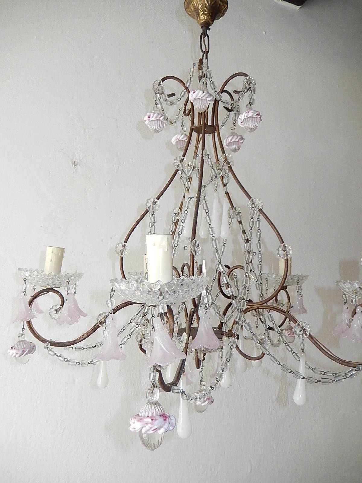 Rewired and ready to hang. Housing five lights, sitting in rare crystal bobeches dripping with pink opaline Murano flowers. Swags of macaroni beads and florets throughout. Adorning white Murano drops and clear oval drops with pink ribbon encircling.