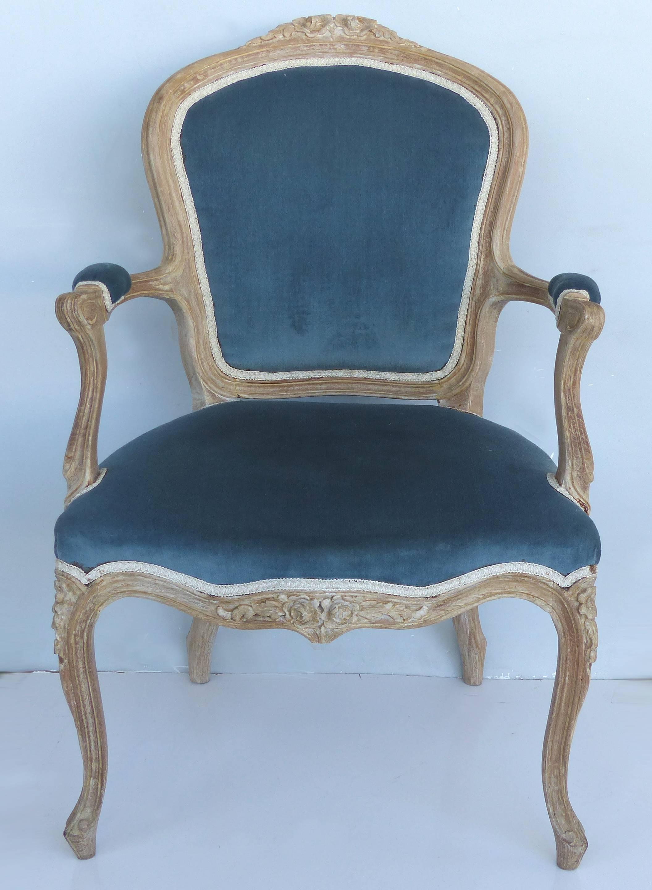French Limed Louis XV Style Fauteuil Chairs with Velvet Mohair Seats with Trim

Offered for sale is an antique pair of French Louis XV style armchairs with a limed finish, upholstered seats in a Celeste blue velvet mohair upholstery with