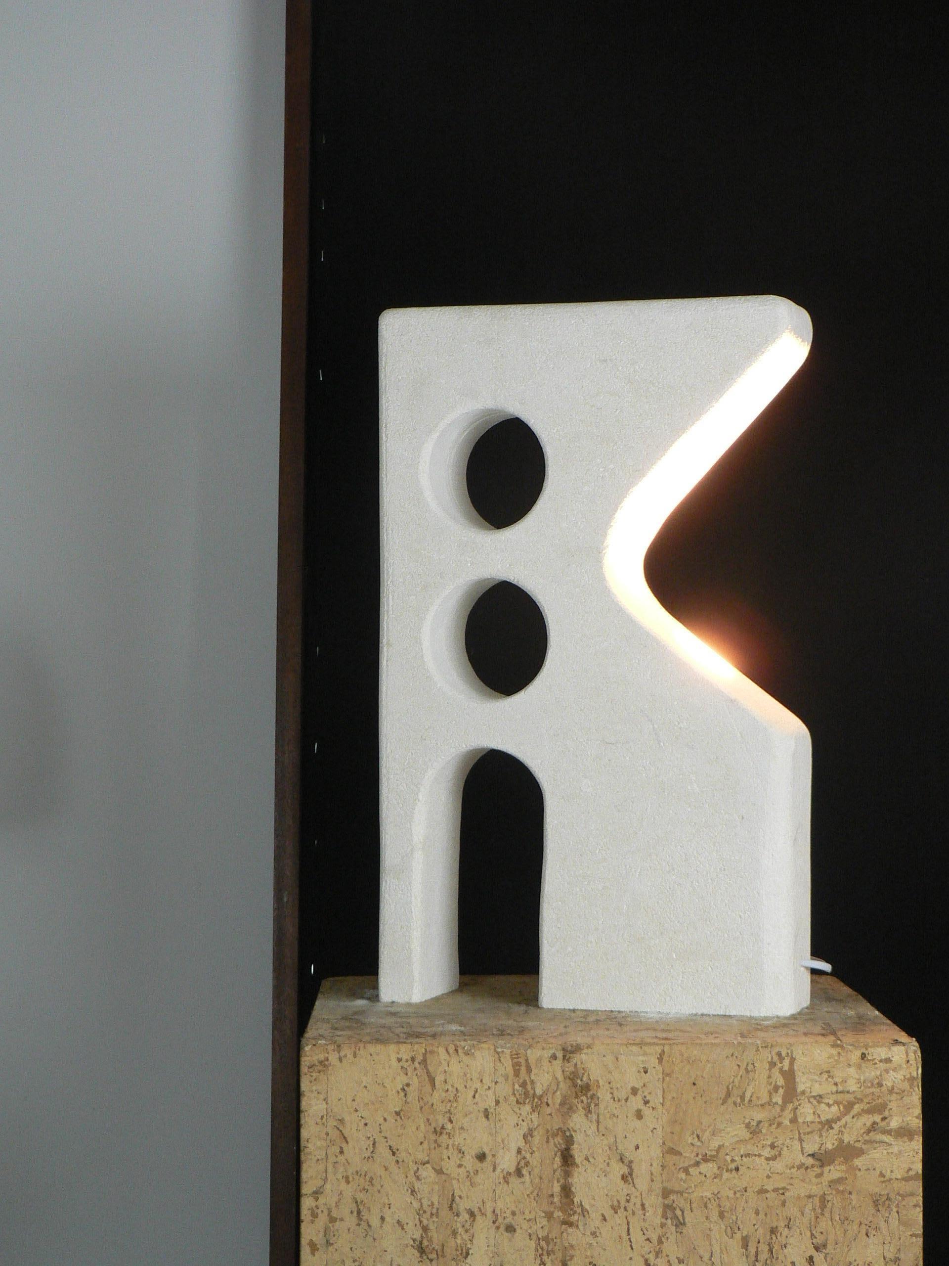Contemporary French limestone carved table lamp. For Sale