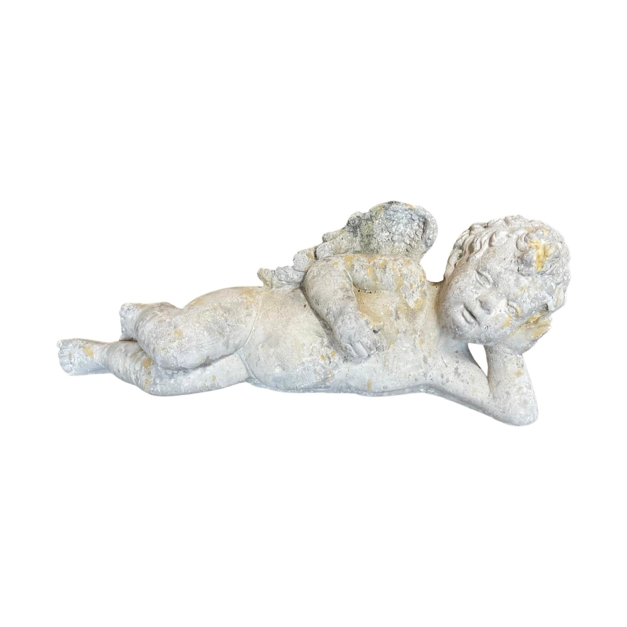 Crafted from limestone composite, this French cherub exudes delicate beauty and timeless elegance. Small in size, it rests peacefully on its side, adding a touch of grace to any contemporary setting. Bring a touch of France to your home with this