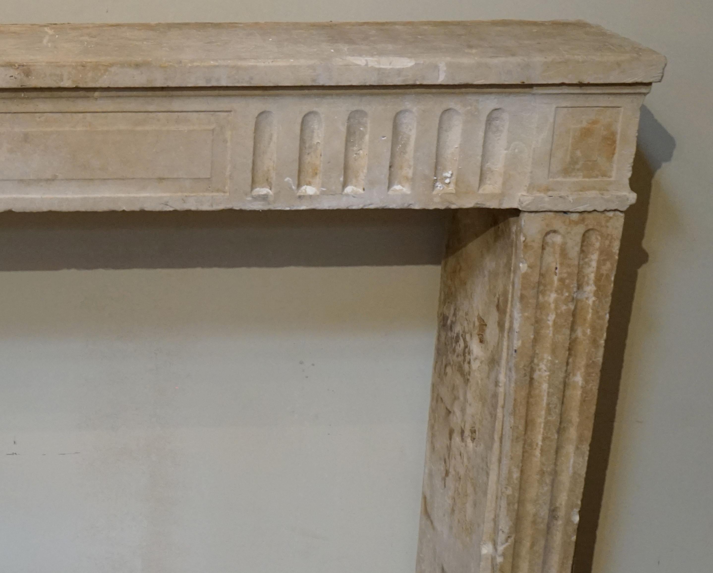 Antique Louis XV limestone mantel from France, circa 1750.

Measurements: 52'' W x 10'' D x 39'' H
Firebox: 32'' H x.