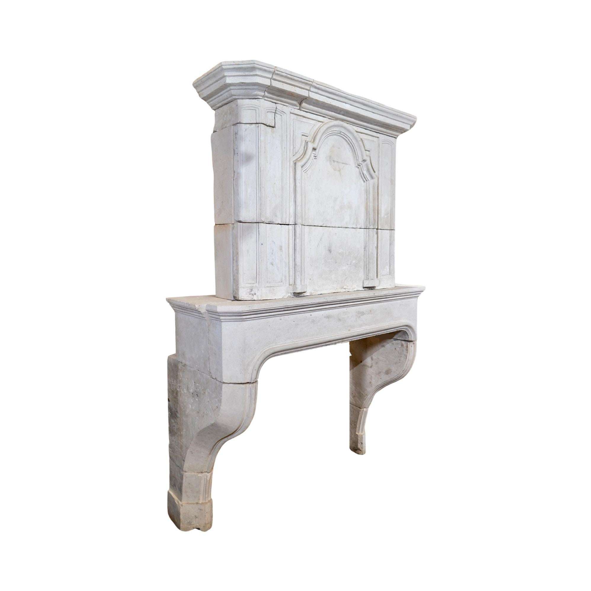 Early 18th Century French Limestone Fireplace For Sale