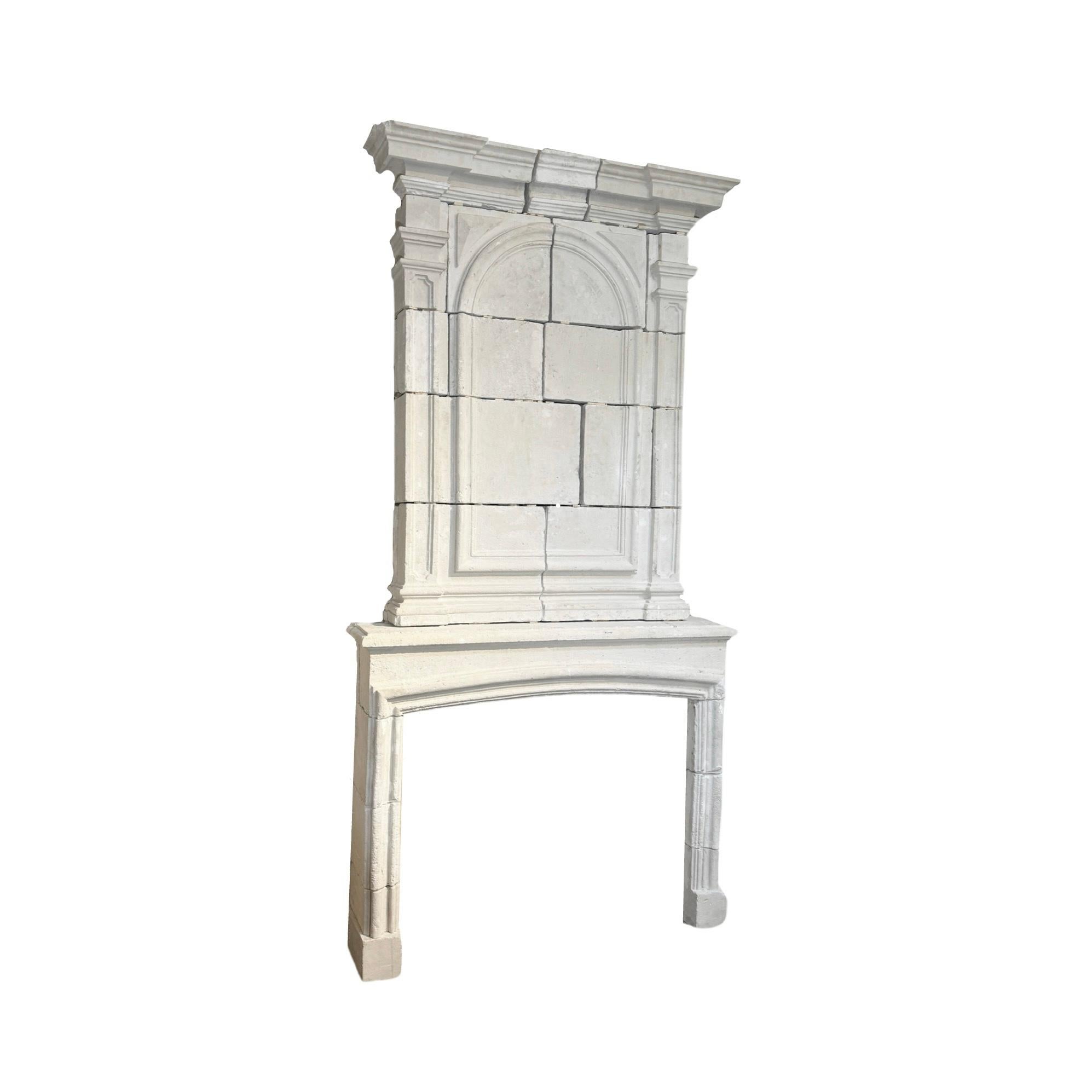 This 1850s French limestone fireplace mantel brings a touch of history and elegance to any home. Crafted in a Louis XIII style, the antique mantel adds a unique touch to your fireplace while bringing the durability and beauty of French limestone.