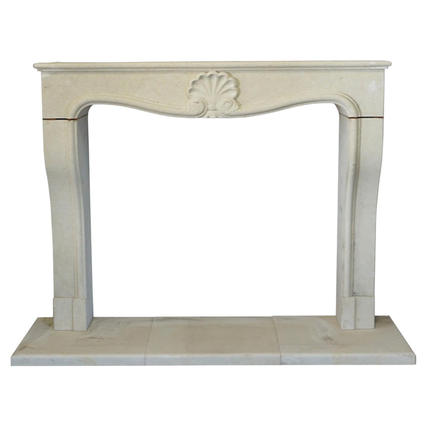 Hand-Carved French Louis XV Limestone Fireplace Surround, Rococo Style