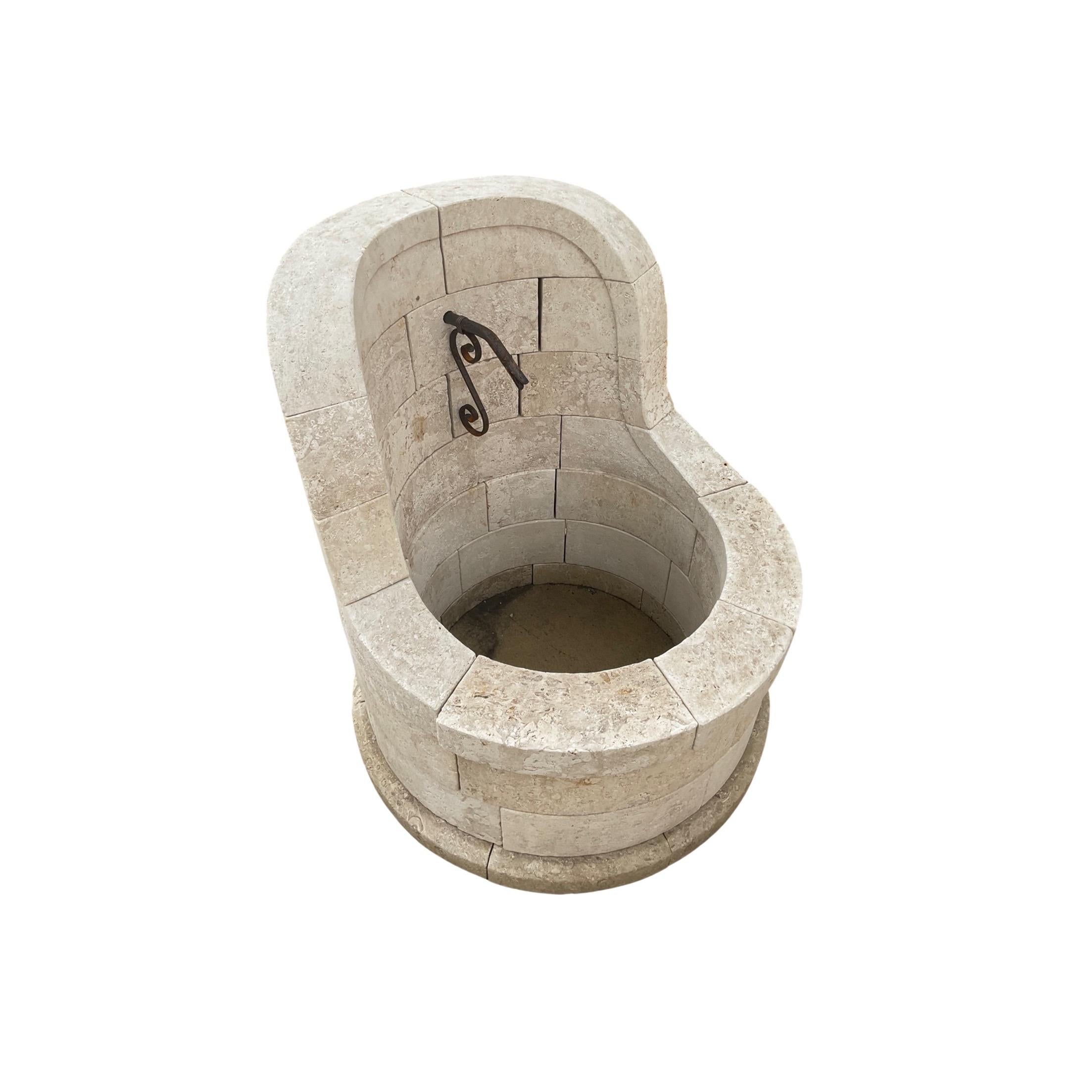 This French Limestone Fountain is a stunning addition to any garden. Made with a circular round style trough from 18th century limestone, this fountain naturally captivates with its timeless aesthetic. Enjoy the calming sound of the one spout water