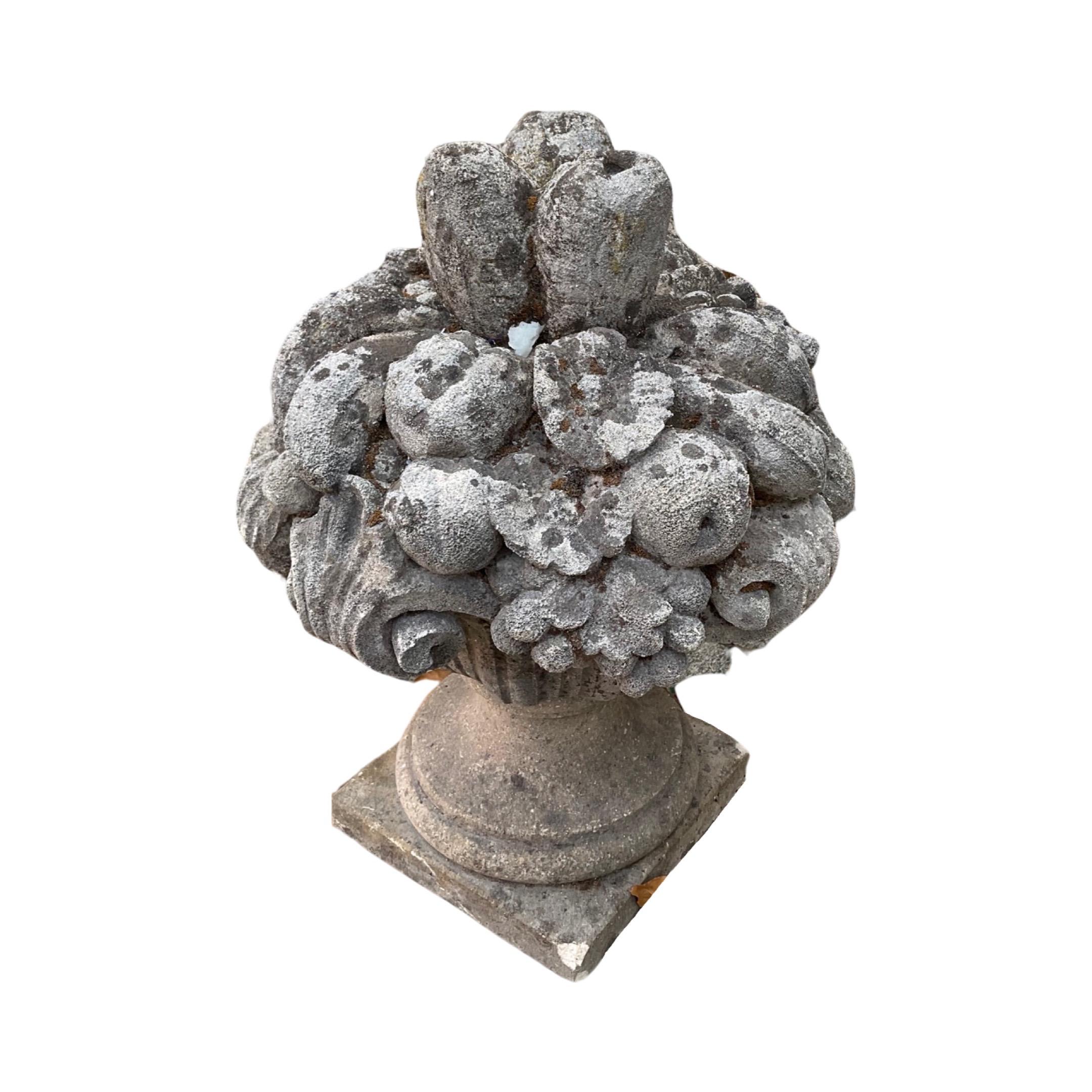 This timeless 18th century French Limestone Fruit Bouquet Sculpture is a classic decor element for a garden. Crafted from elegant limestone material, the sculpture features precise details and intricate silhouettes of a fruit bouquet. Add a touch of