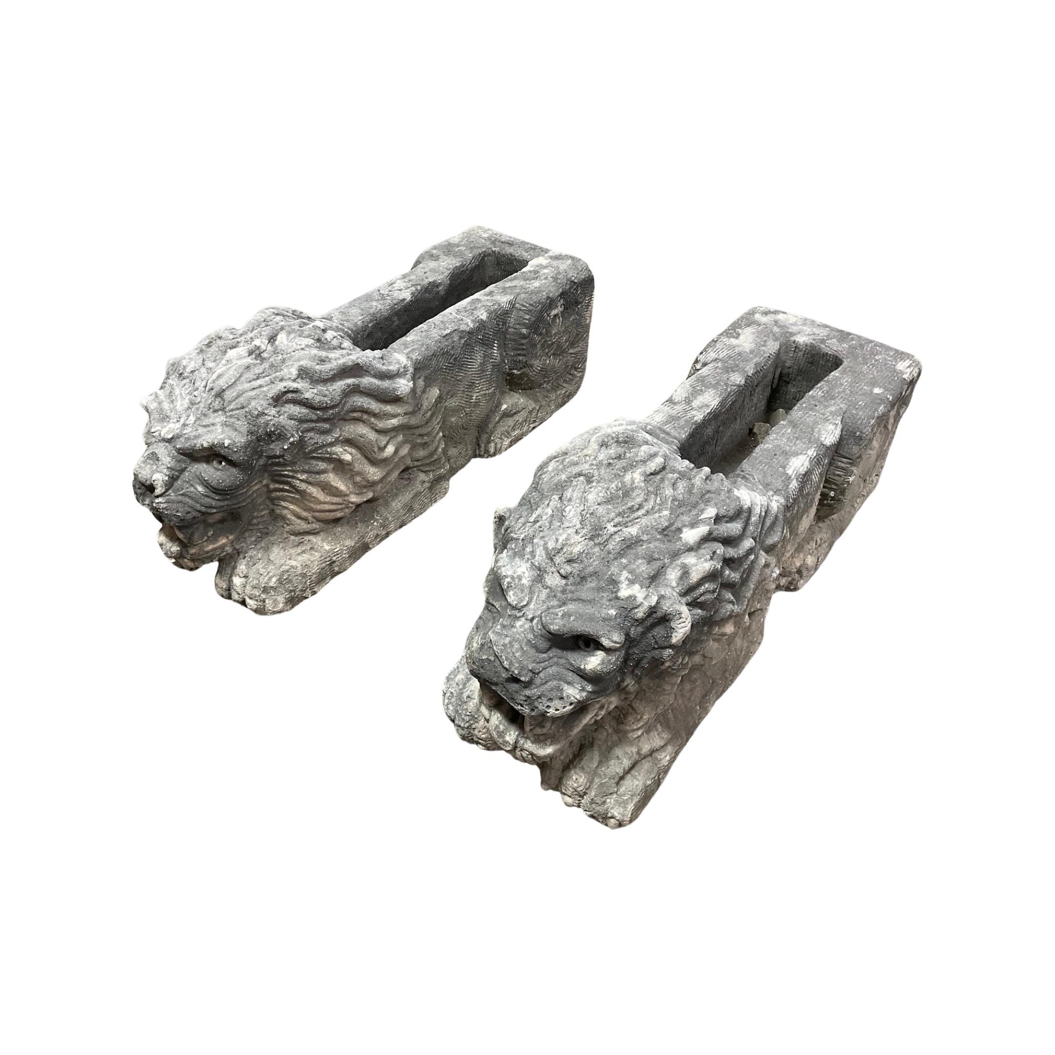 These unique 18th century Lion Carved Downspout Water Exits from France are a stunning addition to any outdoor space. Expertly crafted out of limestone, this pair brings a timeless beauty to your garden or patio. Add a piece of history to your