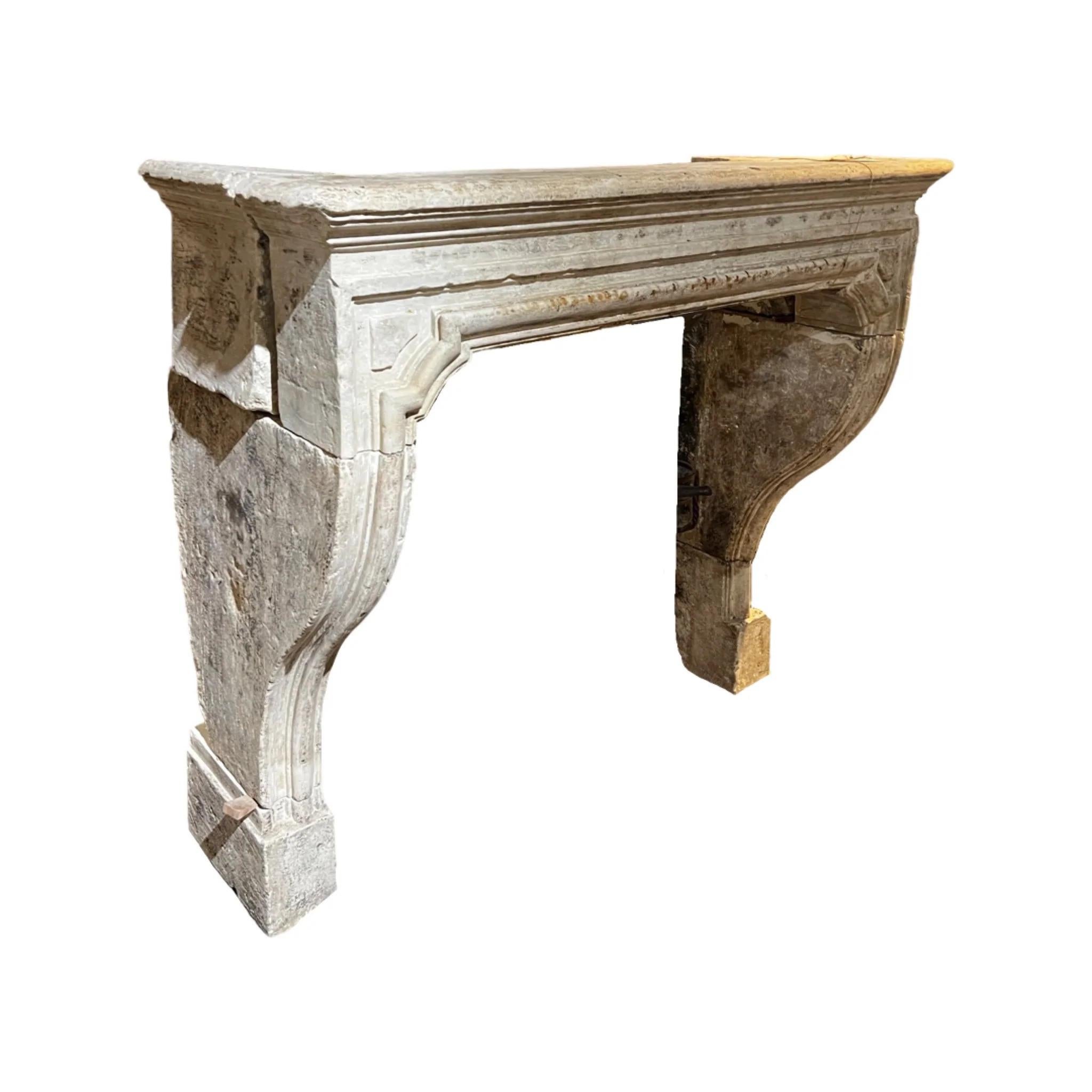 Louis XVI style mantel. Made out of limestone. Originates from France. Circa, 1720.