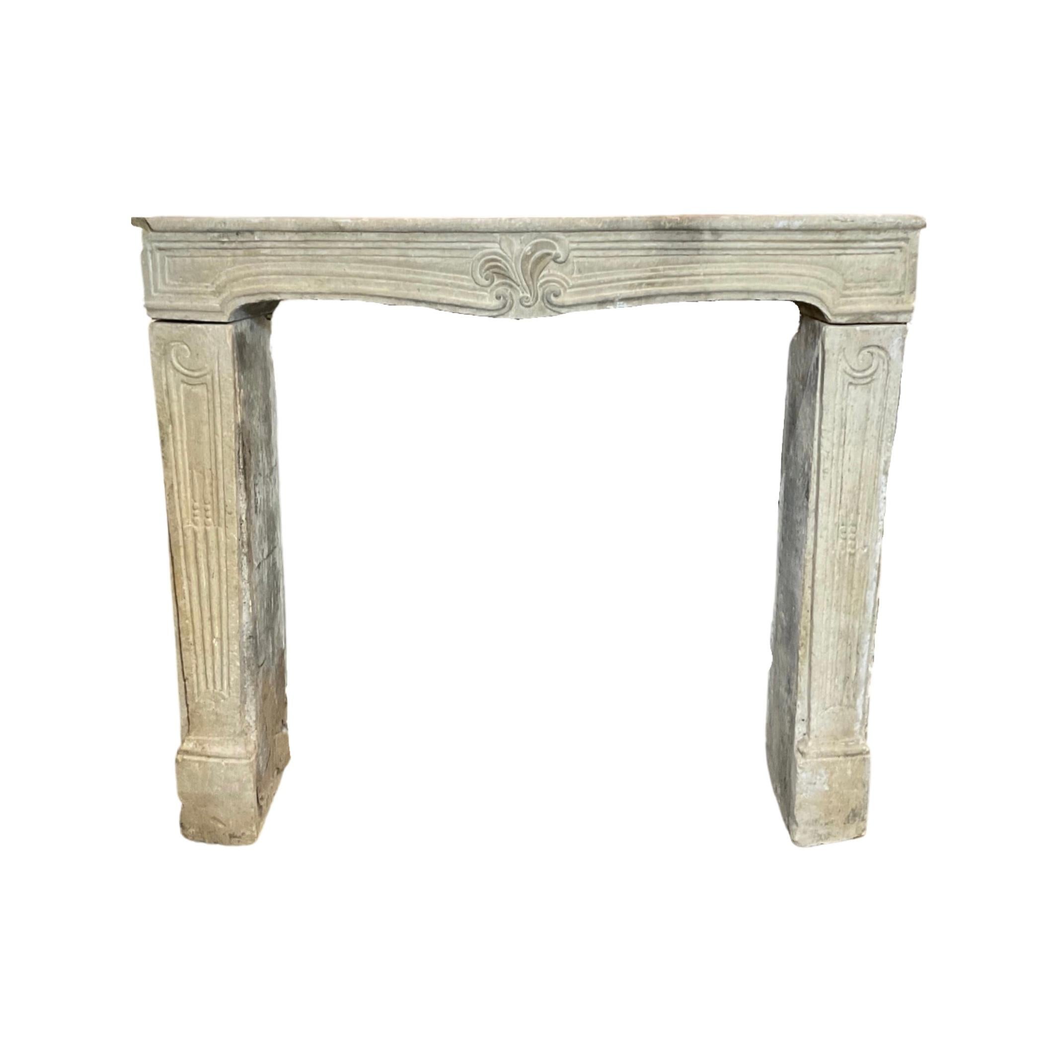 This French limestone mantel, crafted in the Louis XVI style circa 1820, is a stunning example of the elegance and sophistication of French design. The intricately carved details and gentle curves of the mantel reflect the refined tastes of the era,