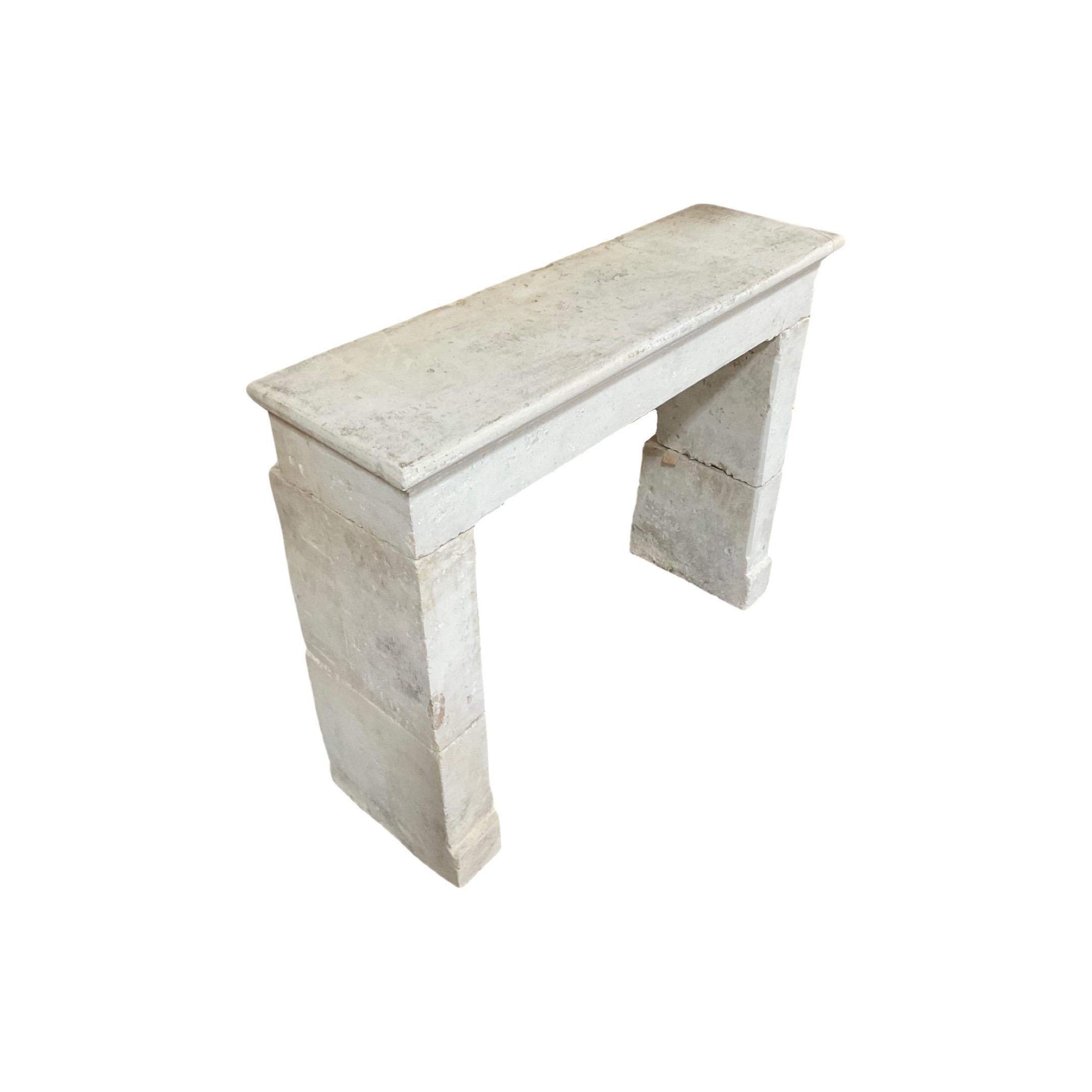 This authentic French Limestone Mantel is a stunning piece from the 1880s. Crafted out of durable limestone, this farm house mantel is the perfect addition to your home or office. With its Classic design, this mantel is a timeless piece and an