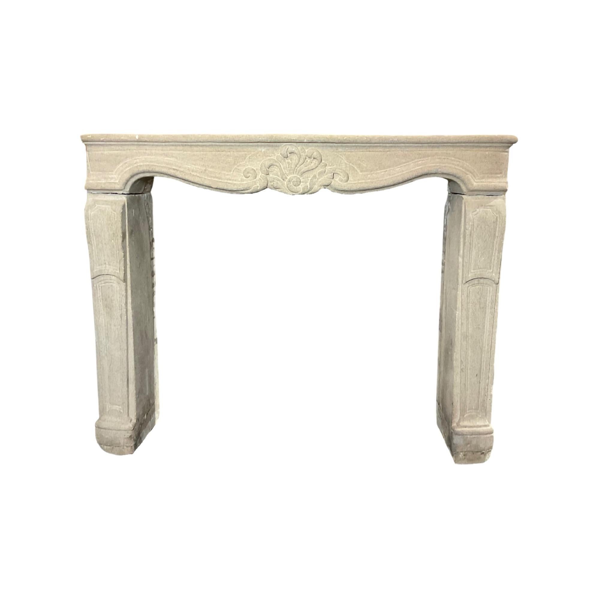 This hand-carved French Limestone Mantel from the 1860s is a beautiful addition to any home. Skillfully crafted with Louis XVI style carvings, this piece of history brings a regal feel. From France, it's an exquisite antiquity worthy of display or
