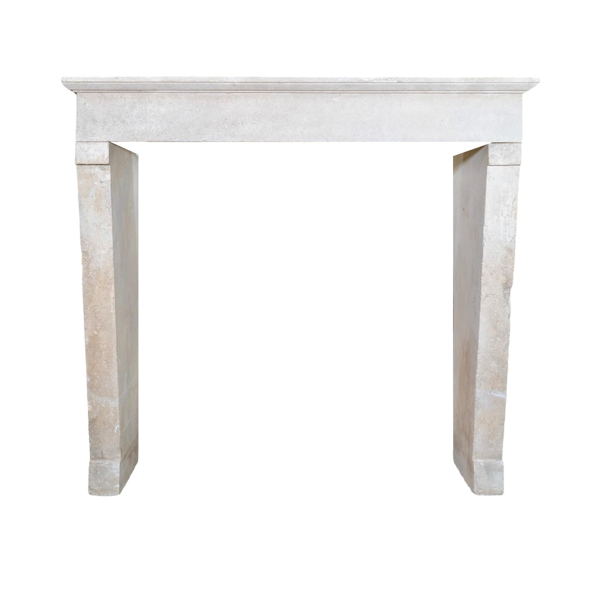 This antique limestone mantel is a simple yet charming addition to any home. Reclaimed from a French farmhouse in the 1870s, it adds a touch of history and elegance to your living space. Crafted from quality limestone, this mantel is a timeless and