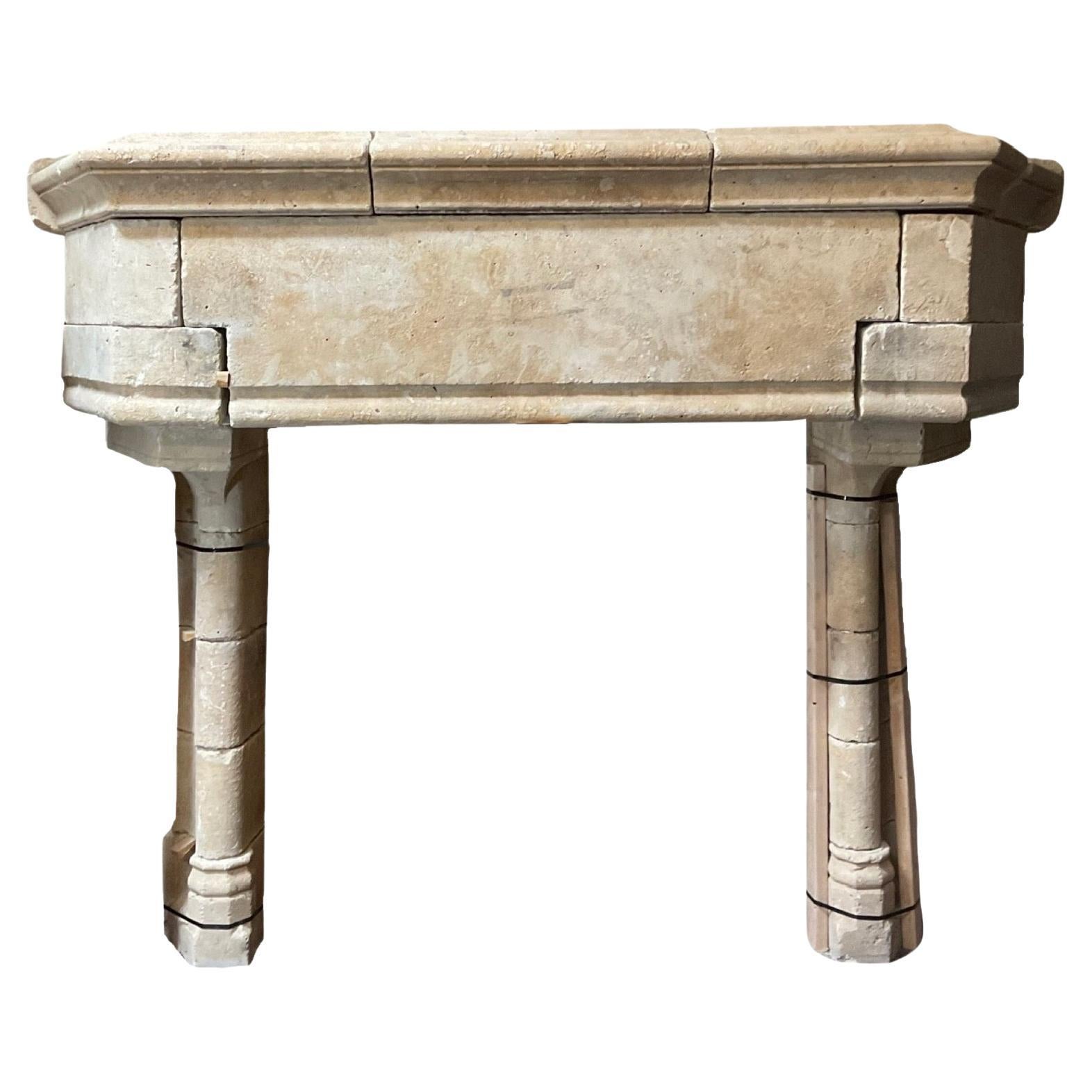 This 17th century mantel is crafted from French limestone, offering a timeless and durable aesthetic for any home. Its large size is perfect for a statement piece in any room. Enjoy the longevity and elegance of this Fine French limestone mantel.