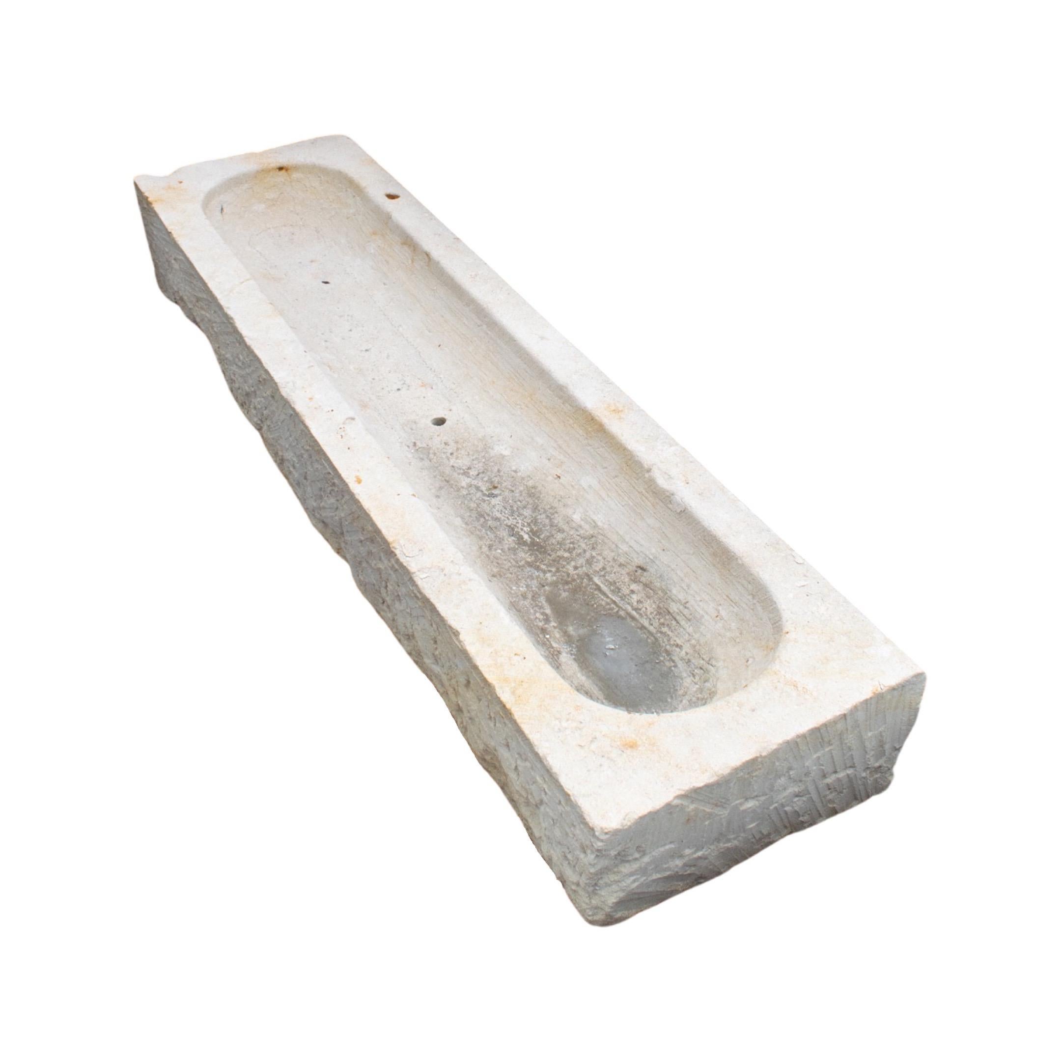 Large narrow style trough. Made out of limestone. Originates from France. Circa, 18th c.