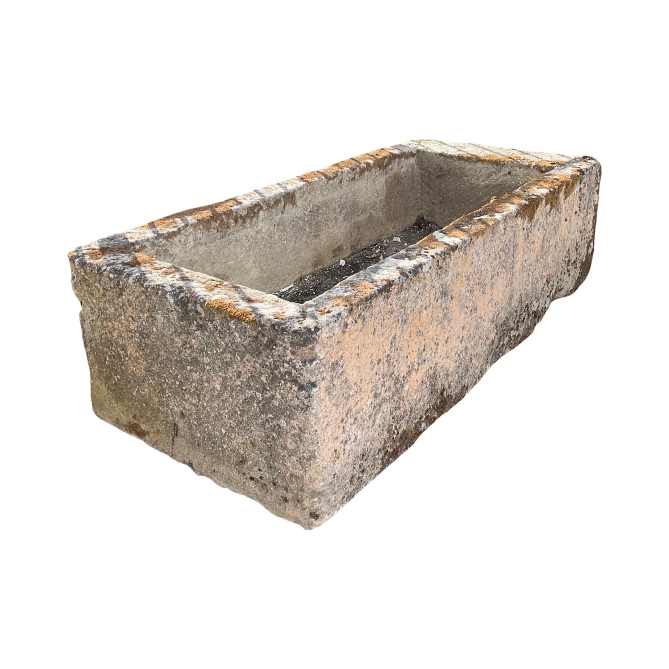 This French Limestone Trough is an authentic antique from the 17th century. Its construction of strong limestone is sure to last, making it a timeless and durable piece. Perfect for adding a classic touch to any garden or interior.