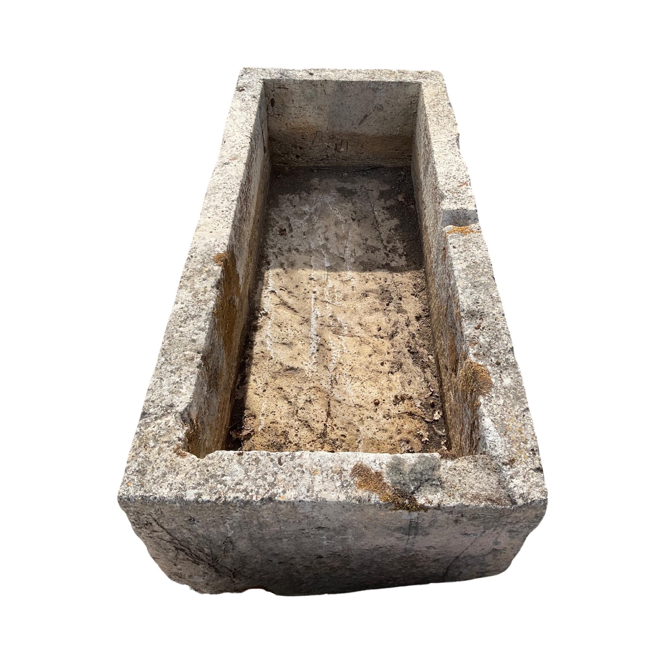 Dating back to the 18th century, this French Limestone Trough is a stunningly authentic antique. Its strong limestone construction ensures its timelessness and durability, making it the ideal piece for adding a classic touch to any outdoor or indoor