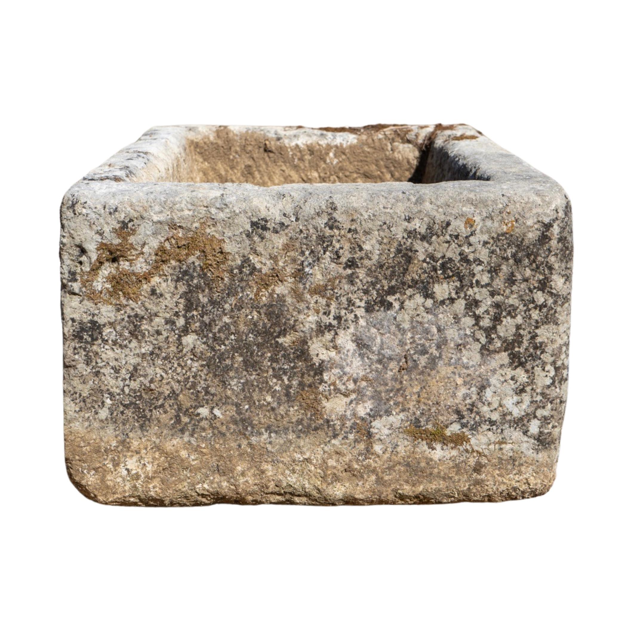 This medium size French limestone trough, crafted in the 1840s, adds a touch of vintage charm to any outdoor space. Its durable construction from premium limestone ensures long-lasting beauty and functionality. Bring a piece of France to your garden