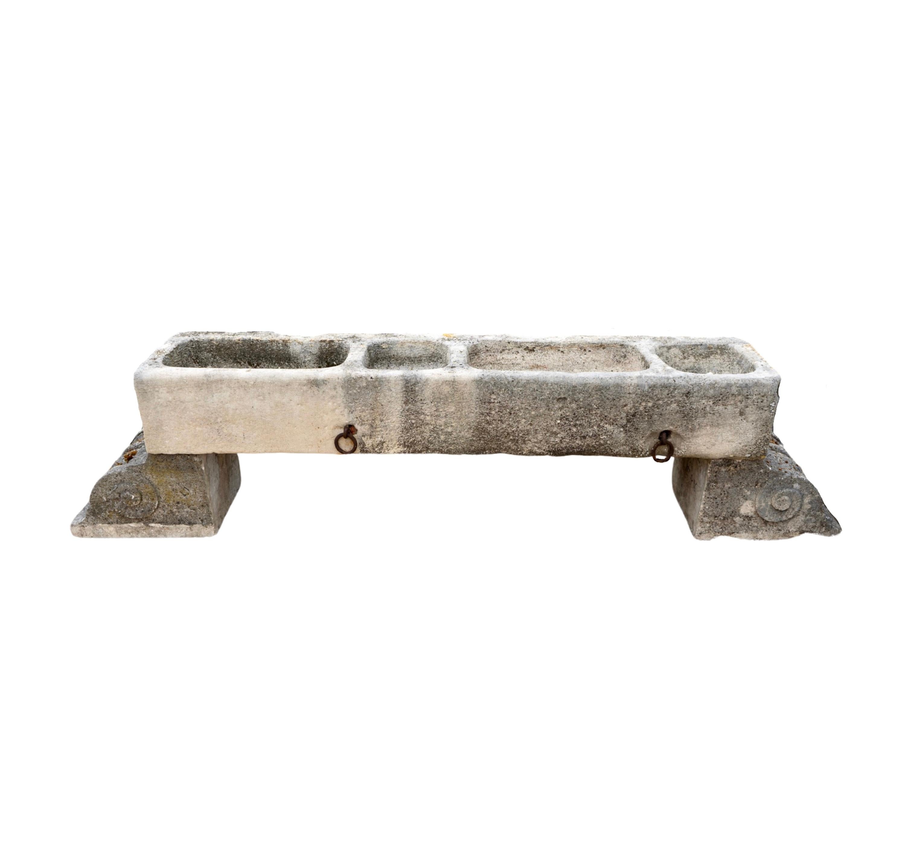 This French Limestone Trough is a 17th-century treasure, expertly carved with four basins for efficient use. It also features two sturdy limestone bases, making it both functional and visually appealing. Additionally, the predrilled holes allow for
