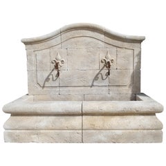 French Limestone Wall Fountain with Carved Fleur de Lys Spouts