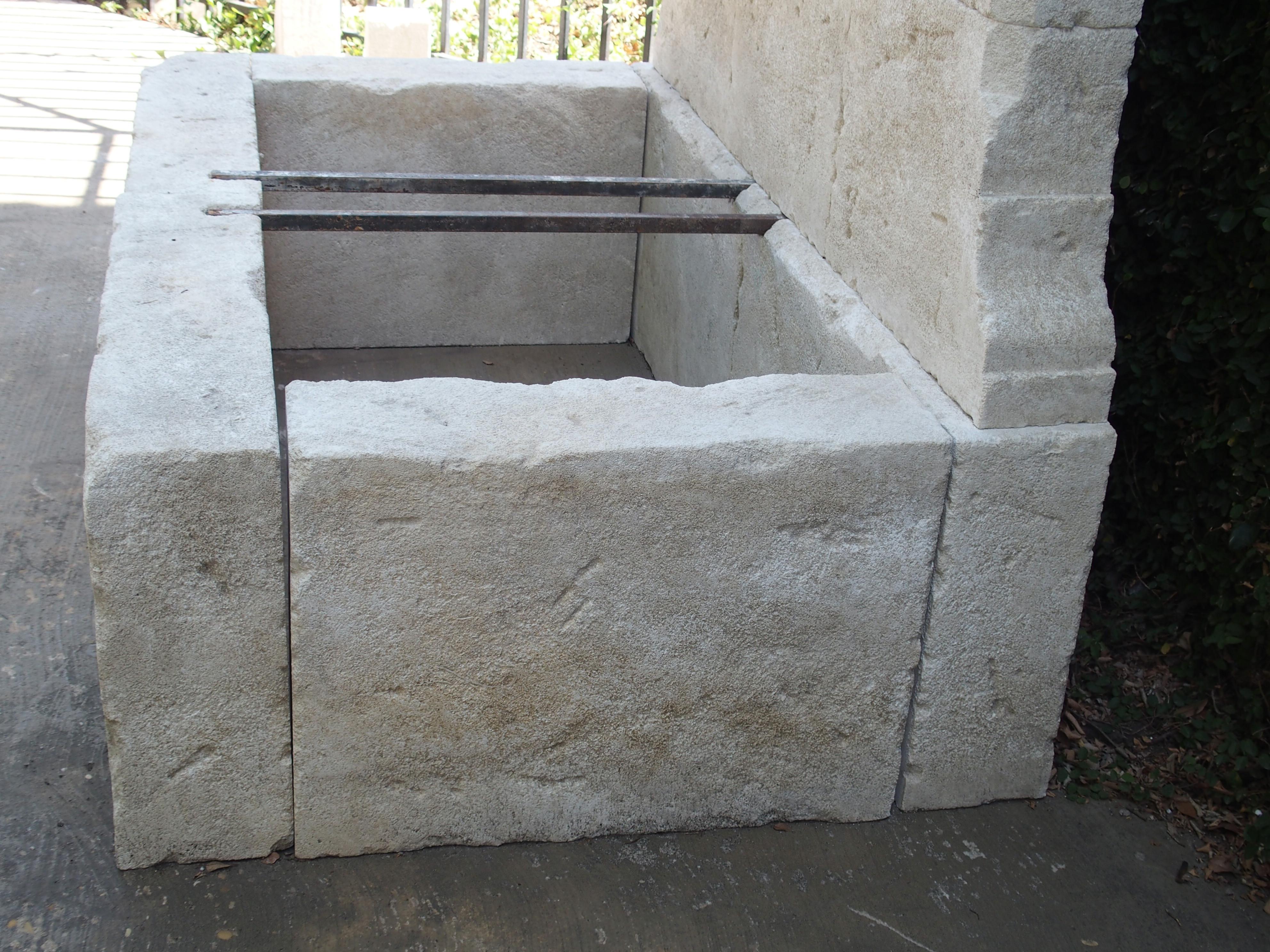 Contemporary French Limestone Wall Fountain with Carved Stone Spout