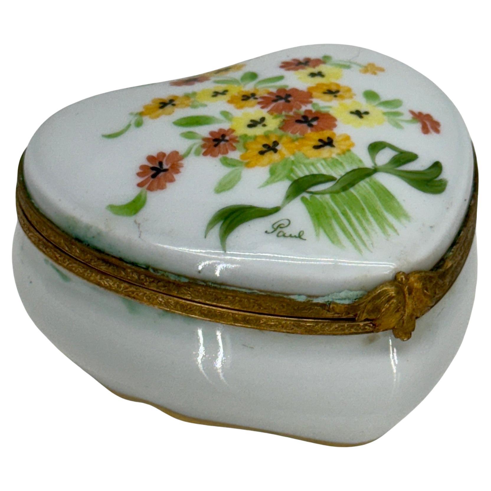 Charming Vintage Limoges heart trinket box hand-painted. The underside of the box is marked Limoges France. This piece would certainly make a wonderful gift for yourself or that special someone in your life. 


