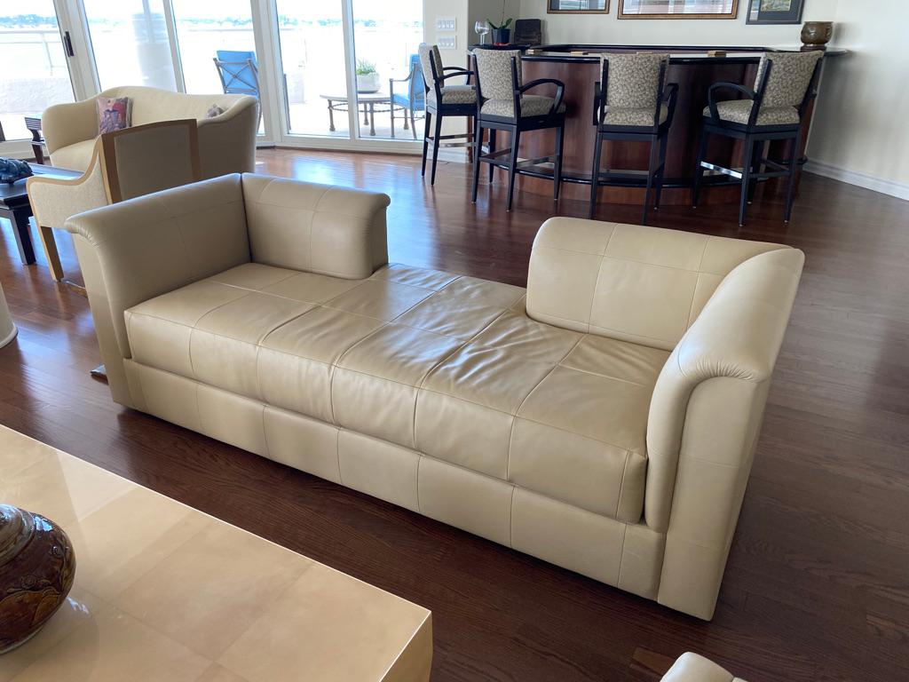 This J. Robert Scott SOFA Tete a Tete lounge is upholstered in fine cream leather, having large squares making up the seat area. There is an opening in the middle back and low arm area to both sides from an Estate on Park Avenue.  In excellent