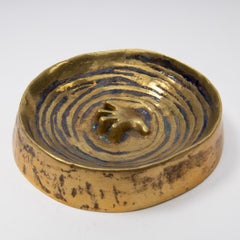 Francese, Line Vautrin, svuotatore da tasca in bronzo dorato "Main dans les flots"