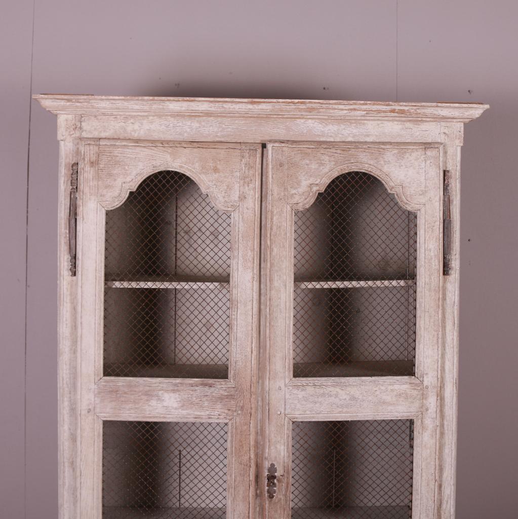 Small washed and bleached French linen cupboard with wire doors. 1880.

Dimensions
43 inches (109 cms) Wide
14 inches (36 cms) Deep
71.5 inches (182 cms) High.