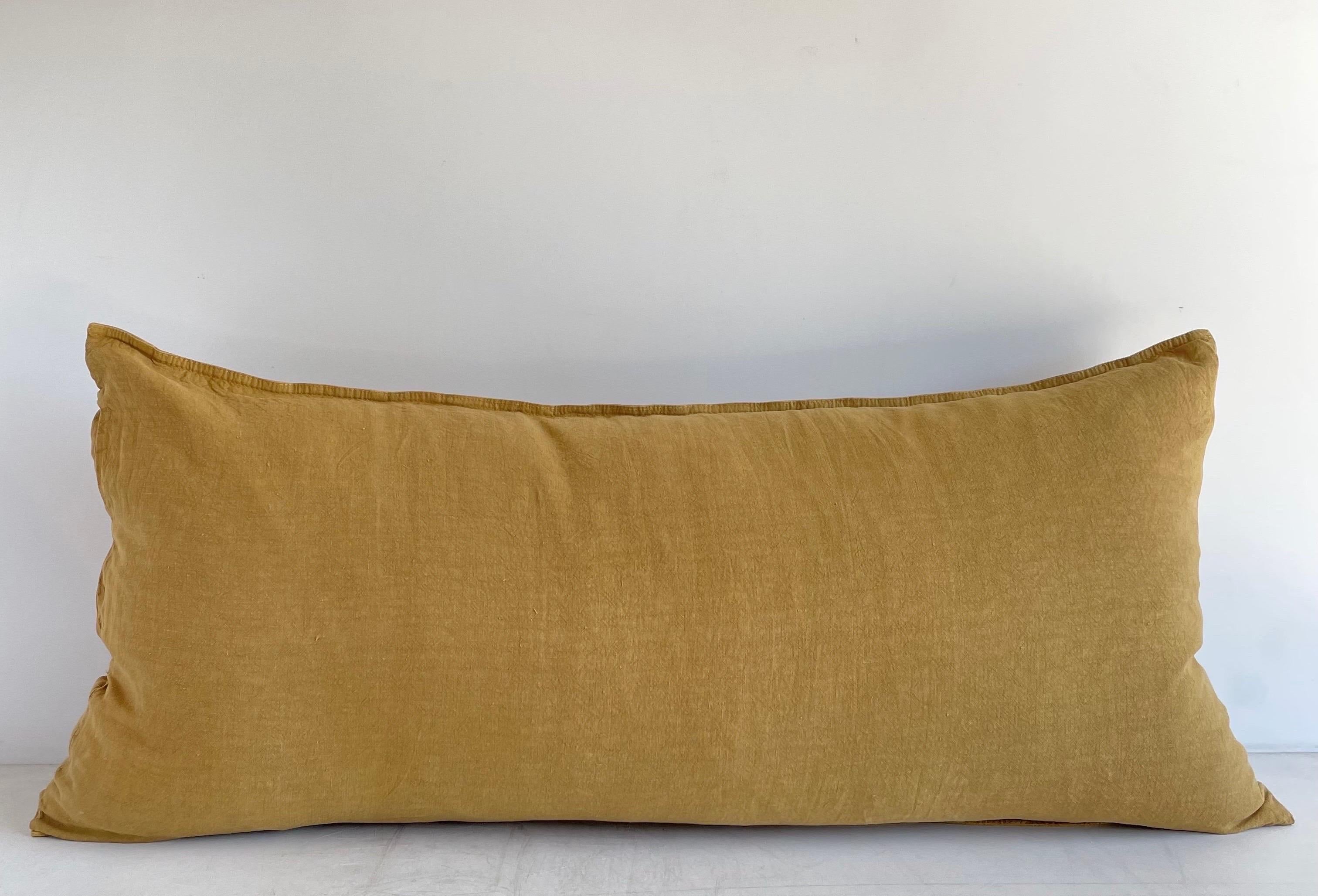 Decorative Accent Pillow in a fine woven smooth soft linen.
Size: 16” x 32” when stuffed with insert. 
Can be used with a low stuffed king size down insert.
Color: Mustard. / French Gold
Decorative Metal buttons at side.
This does not come with