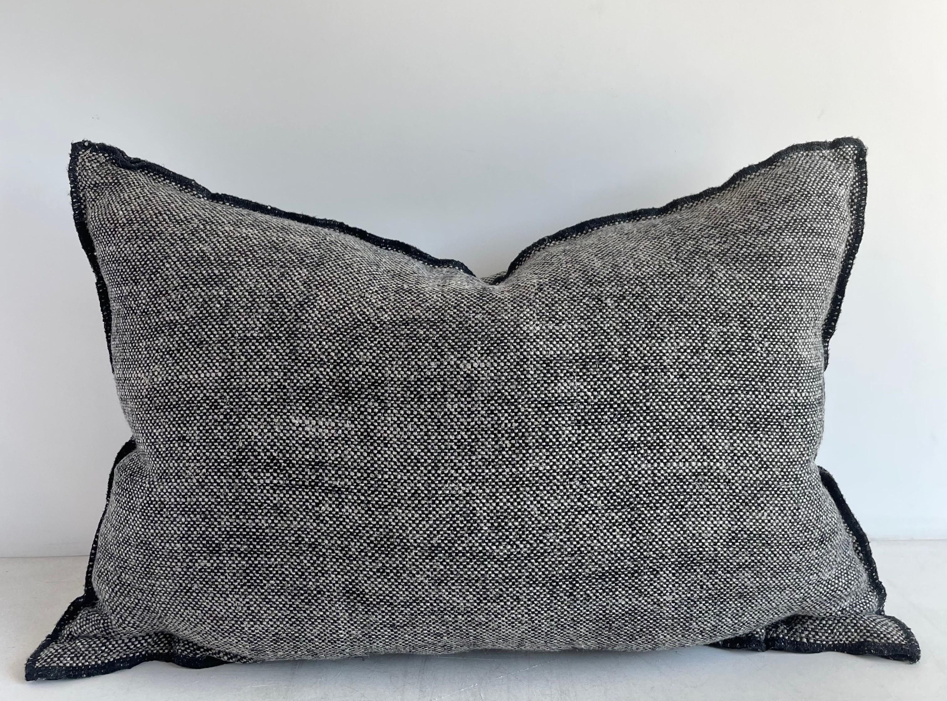 Decorative accent pillow in a thick nubby soft linen.
Size: 16” x 24” when stuffed with insert.
Color: Black and Natural Woven
Decorative Metal buttons at top, or can be used at the bottom, with a decorative stitched edging.
This does not come