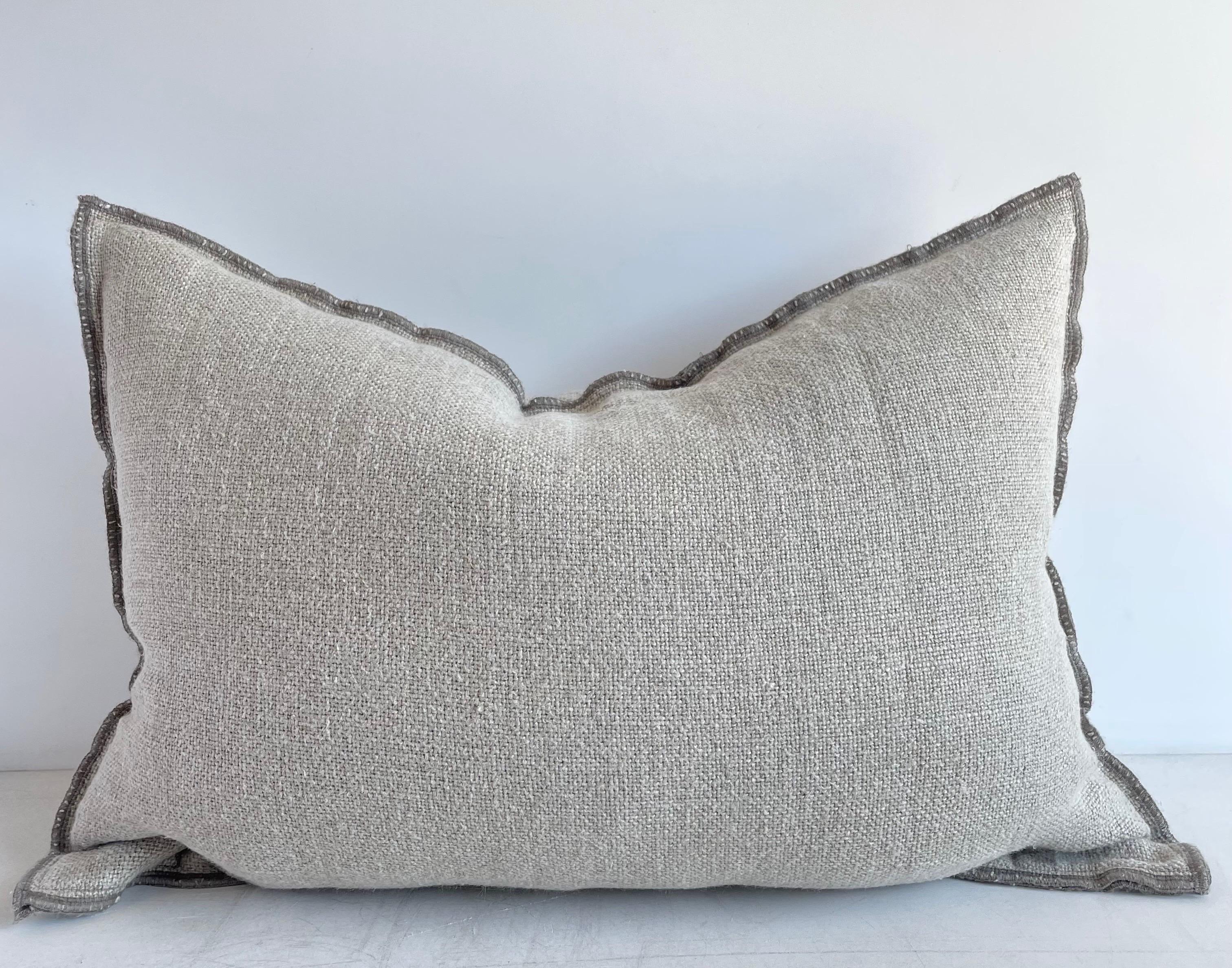 Decorative accent pillow in a thick nubby soft linen.
Size: 16” x 24” when stuffed with insert.
color: Natural Flax 
Decorative Metal buttons at top, or can be used at the bottom, with a decorative stitched edging.
This does not come with