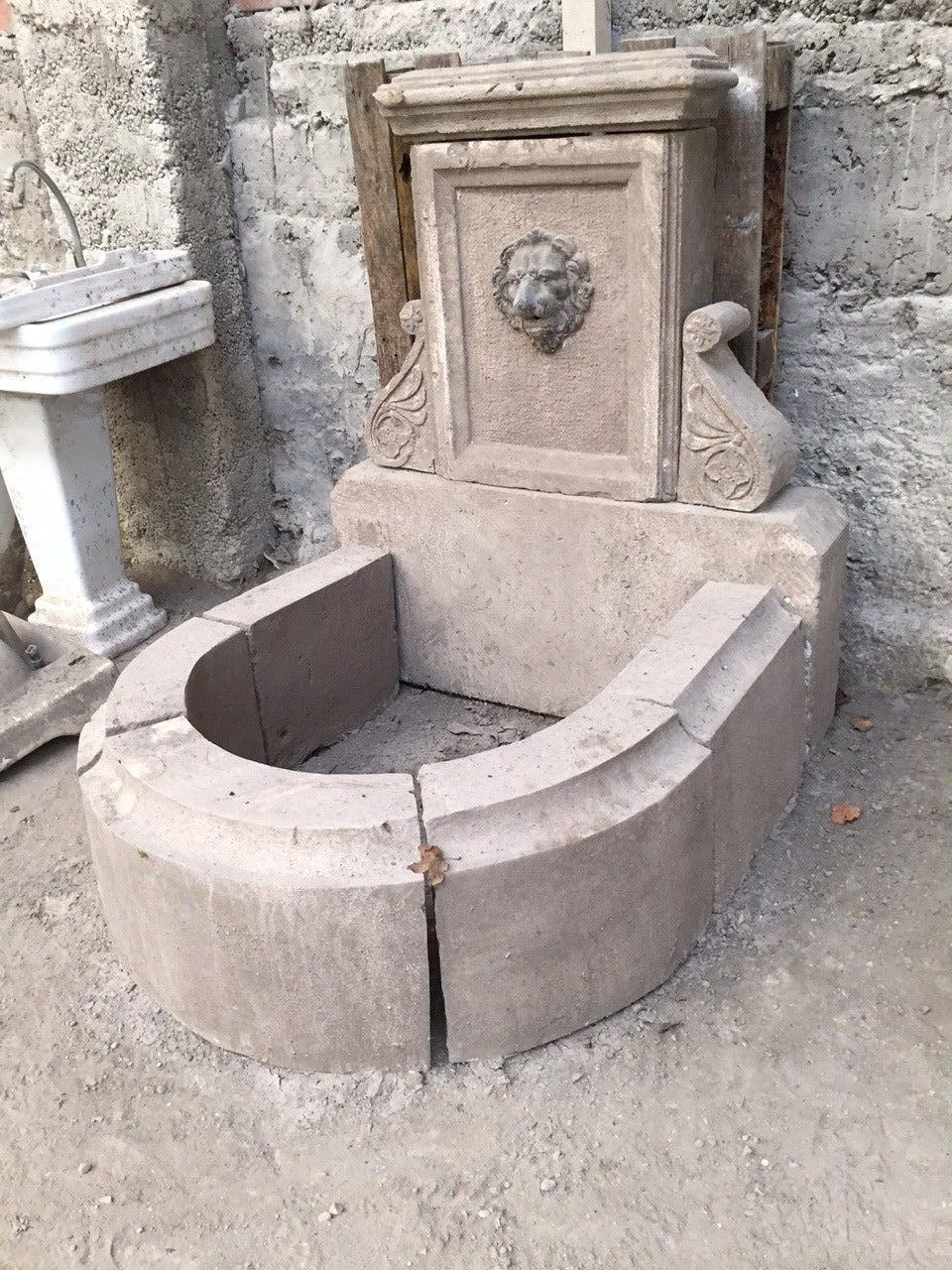 A French Louis XIV style fountain hand carved in French antique limestone, with water-fall in lions head (Val d Osne style iron art piece).
French antique limestone elements reclaimed from the 19th century, from Provence area, French Riviera Coast,