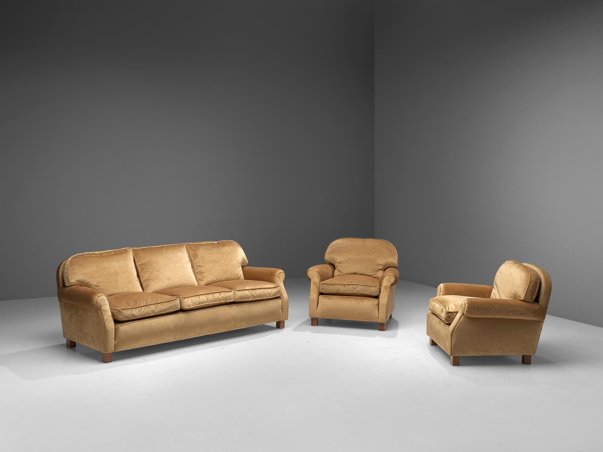 Living room set, three-seat sofa, two lounge chairs, velvet and wood, France, 1940s.

Grand and comfortable three-seat sofa and two beautiful lounge chairs in a beige velvet upholstery. Very comfortable pieces that feature deep and thick seats with