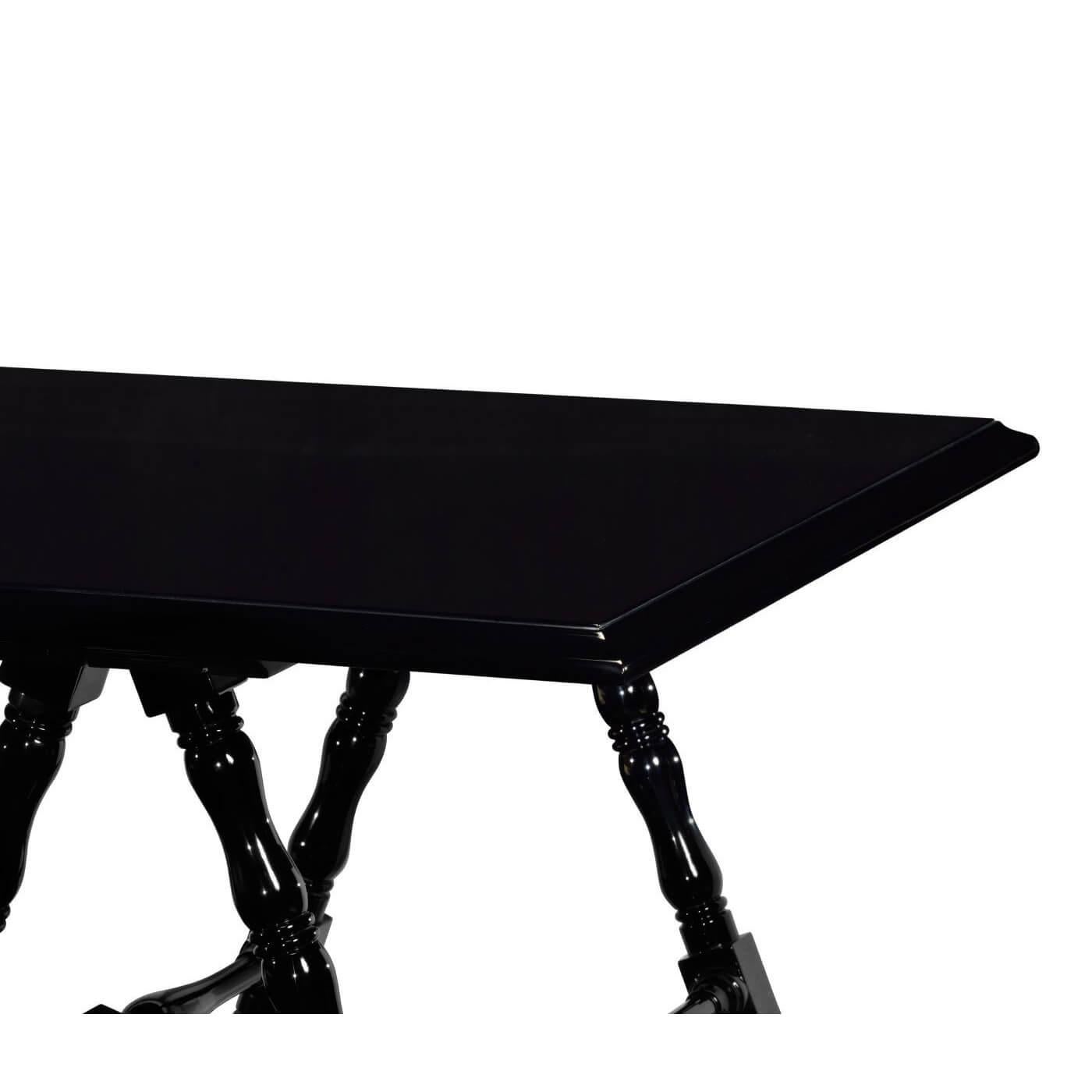 A French Louis Philippe style black lacquered and polished desk with campaign-style X frame supports, each with turned legs and stretchers on brass feet.

Dimensions: 84