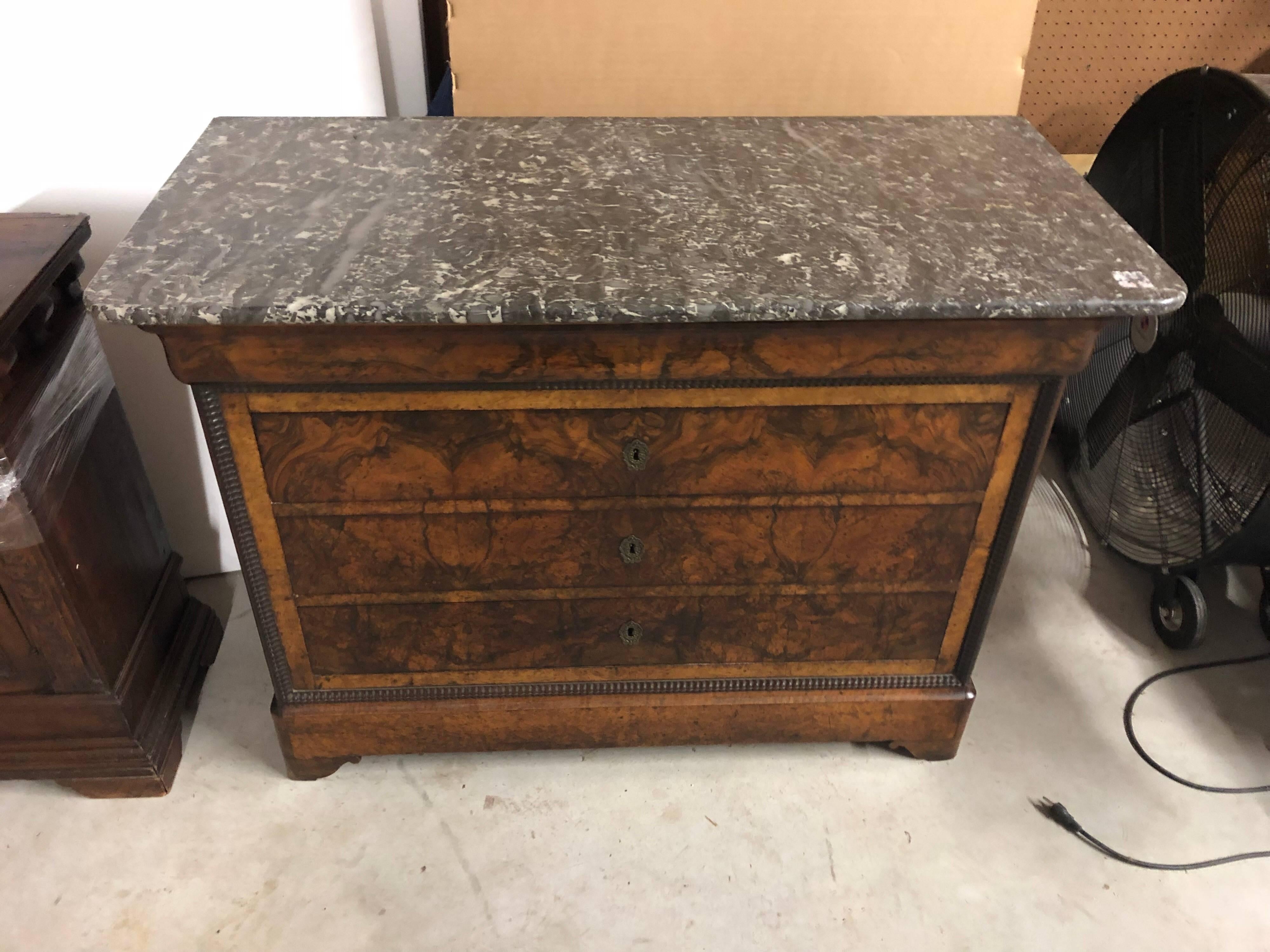 French Louis Phillippe burl walnut commode with marble top.