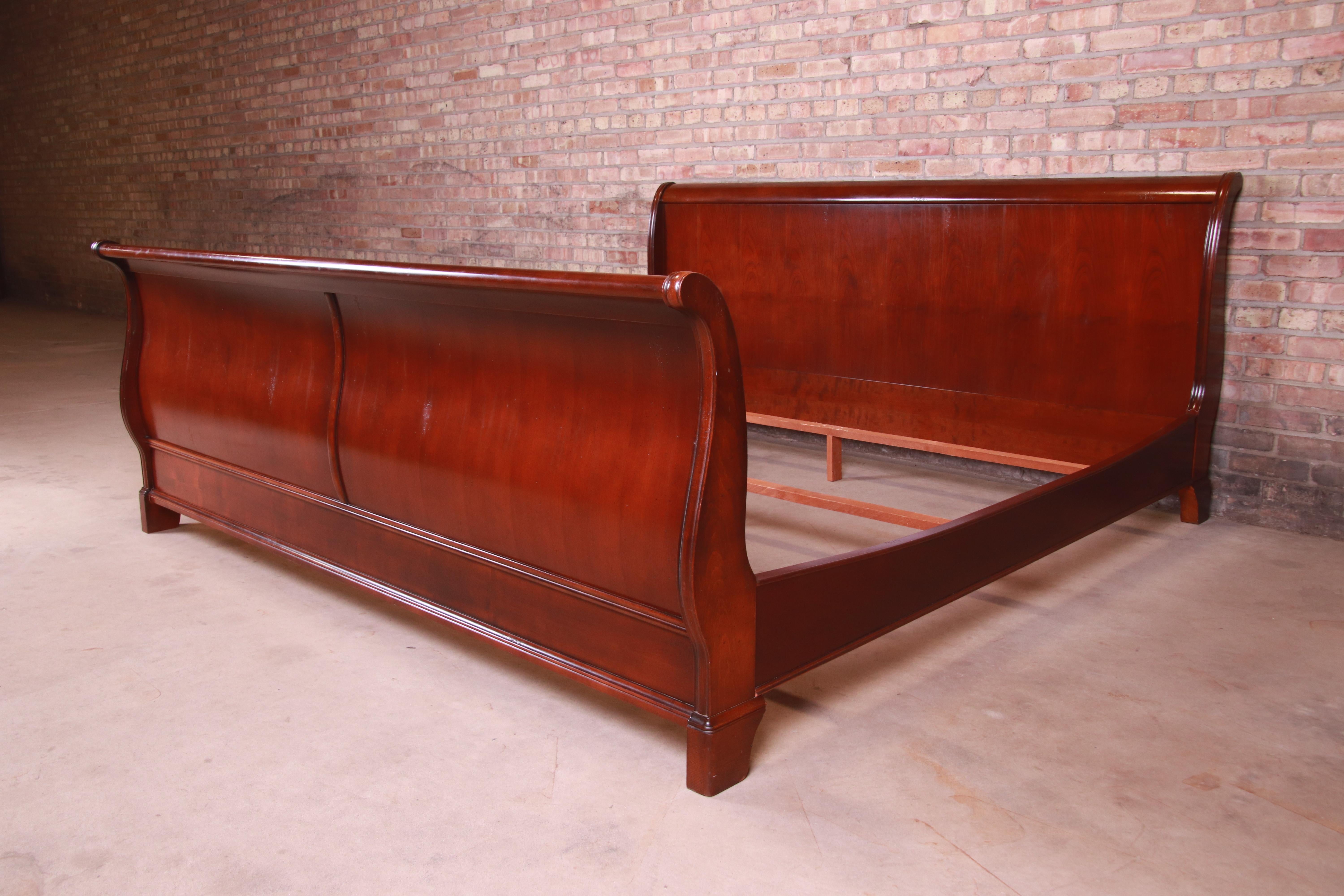 A gorgeous French Louis Philippe style solid cherry wood king size sleigh bed

France, Circa 1980s

Measures: 83.5