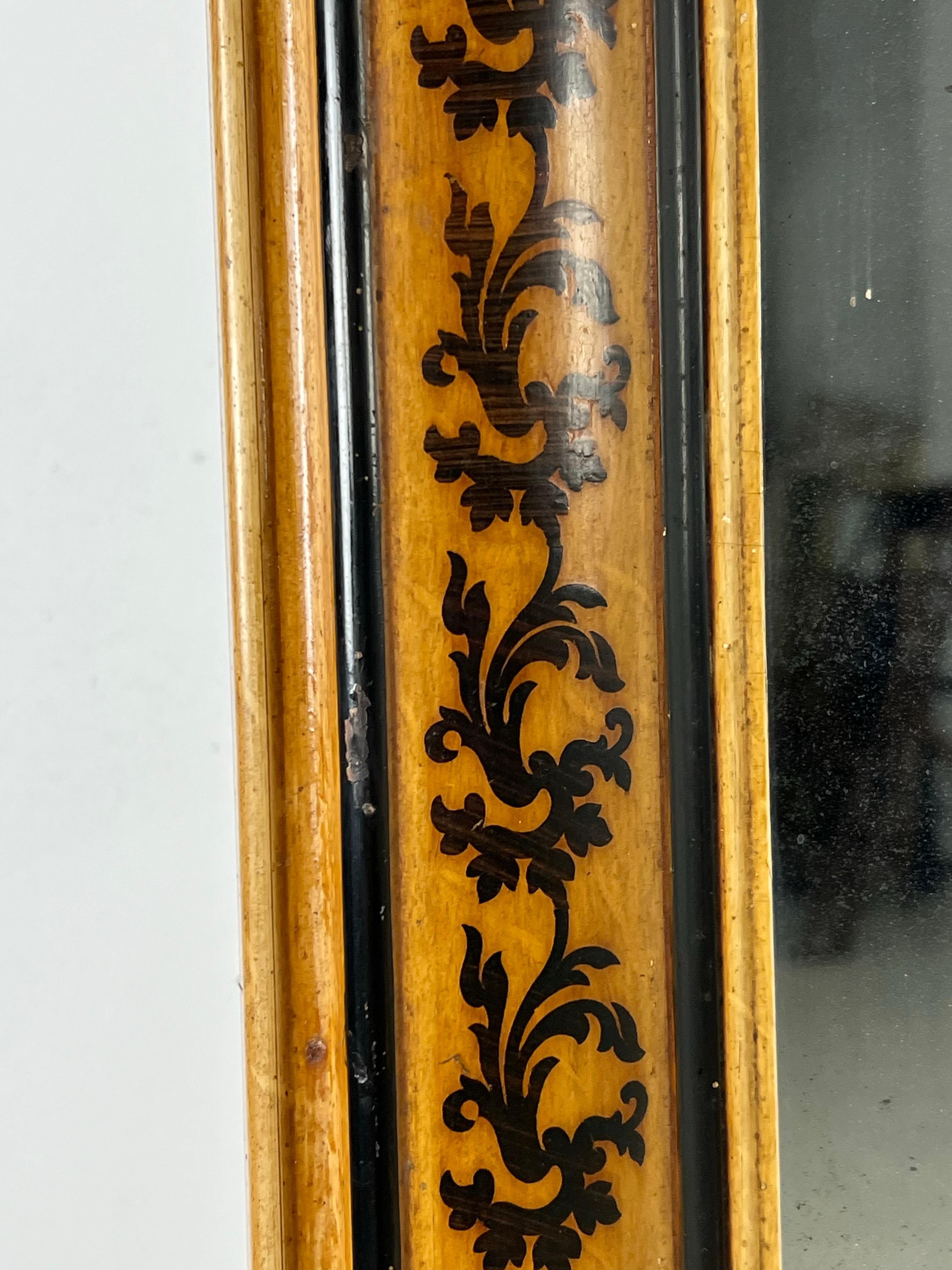 Beautiful French Louis Philippe mirror. Faux bois painted with black outline and wooden floral design all over the frame.

With original mercury glass. Mirror is in very good condition!

Dimensions: 81,5w x 125h