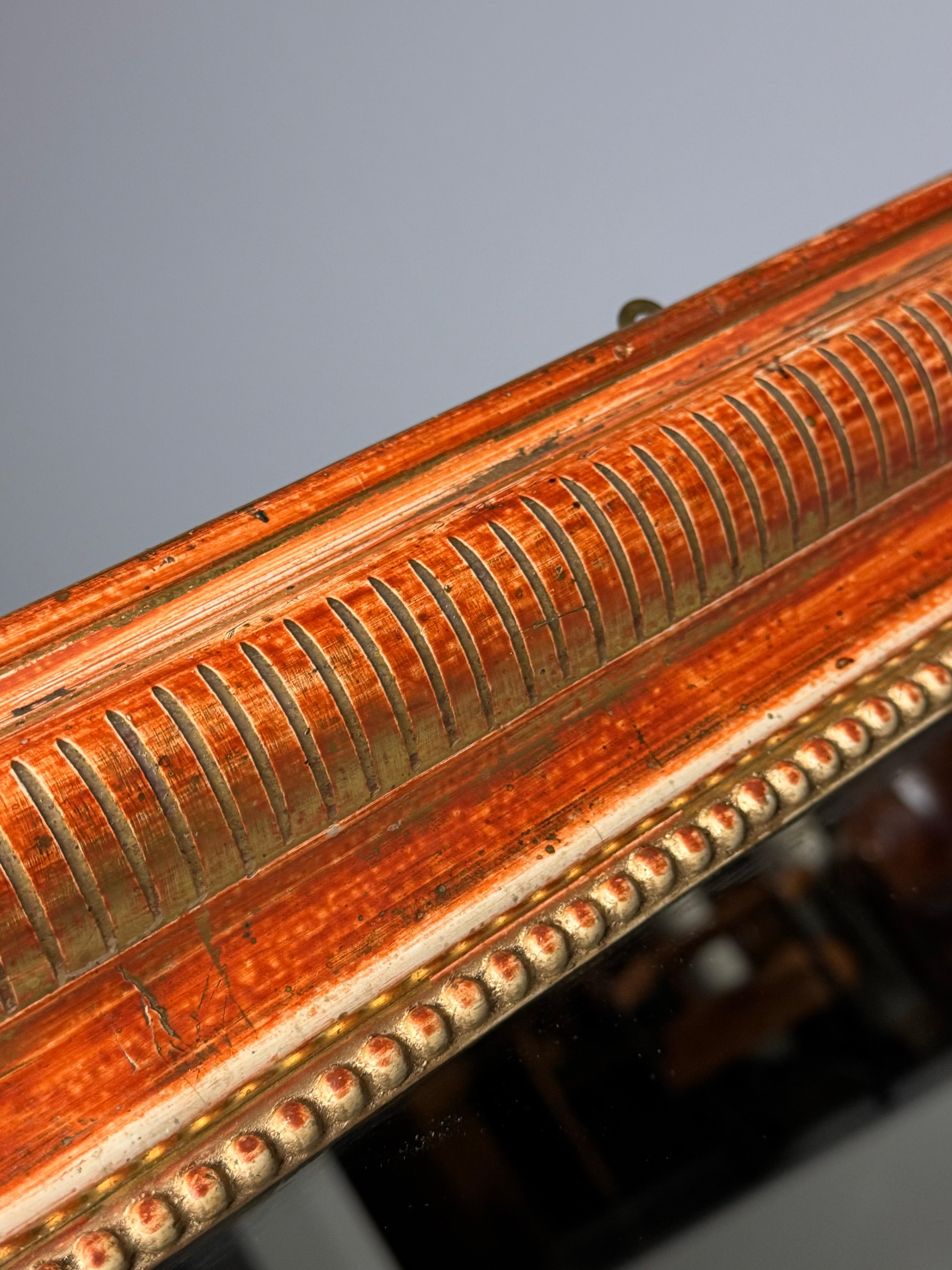 Espejo antiguo. Original de Francia, época Louis Philippe. Color naranja/dorado.

Dimensiones: An. 77,5 x Al. 105