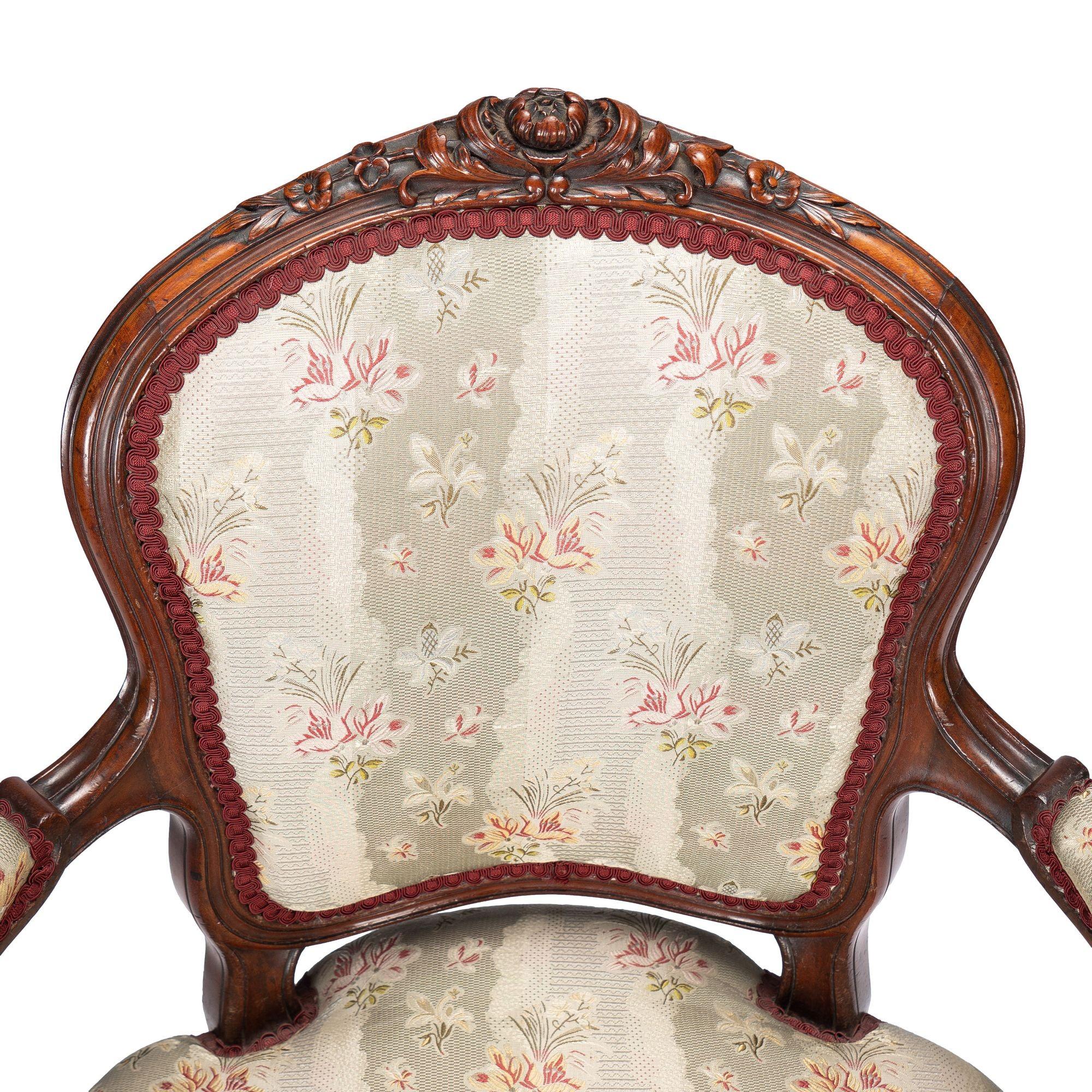 French Louis Philippe period walnut arm chair with paired footstool, c. 1850's For Sale 9