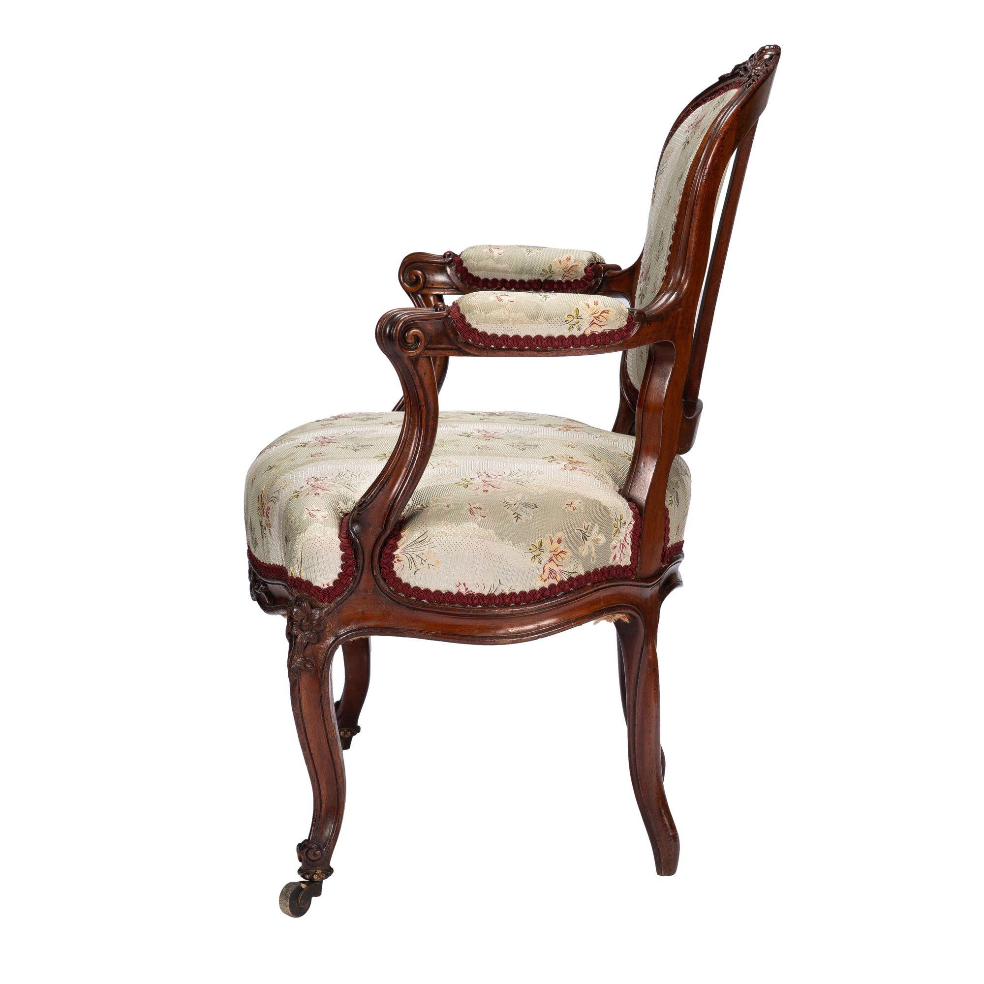 19th Century French Louis Philippe period walnut arm chair with paired footstool, c. 1850's For Sale