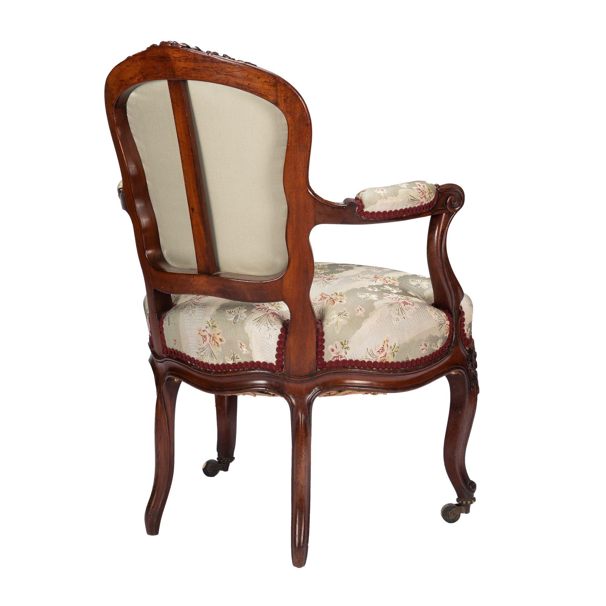 French Louis Philippe period walnut arm chair with paired footstool, c. 1850's For Sale 2