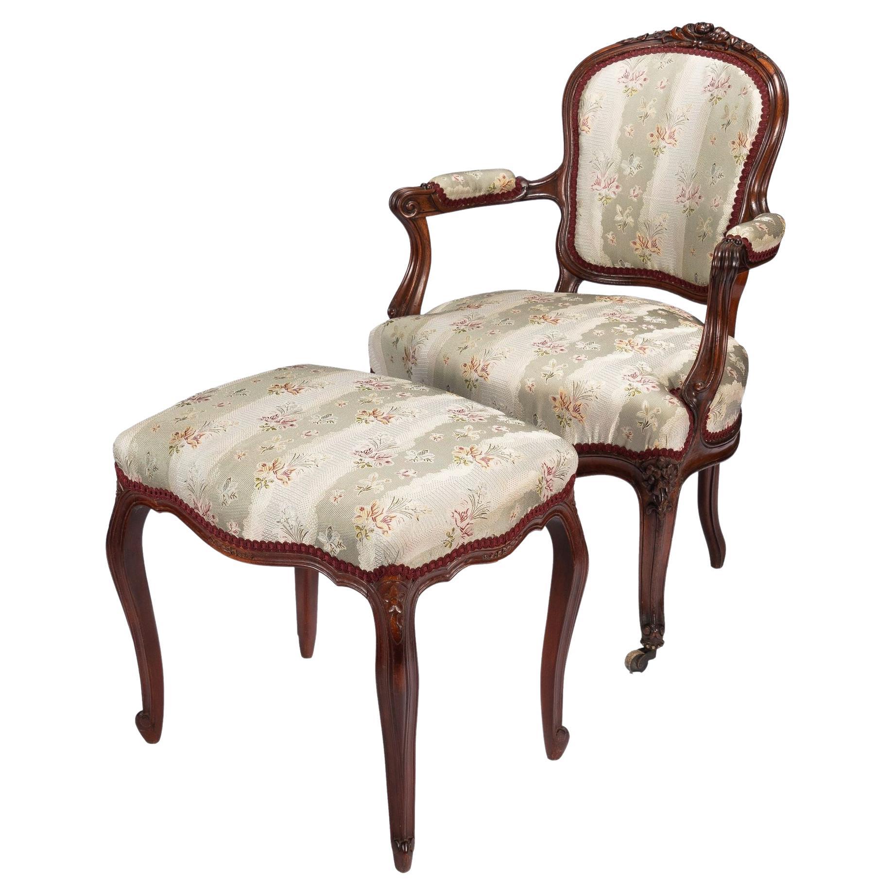 French Louis Philippe period walnut arm chair with paired footstool, c. 1850's For Sale